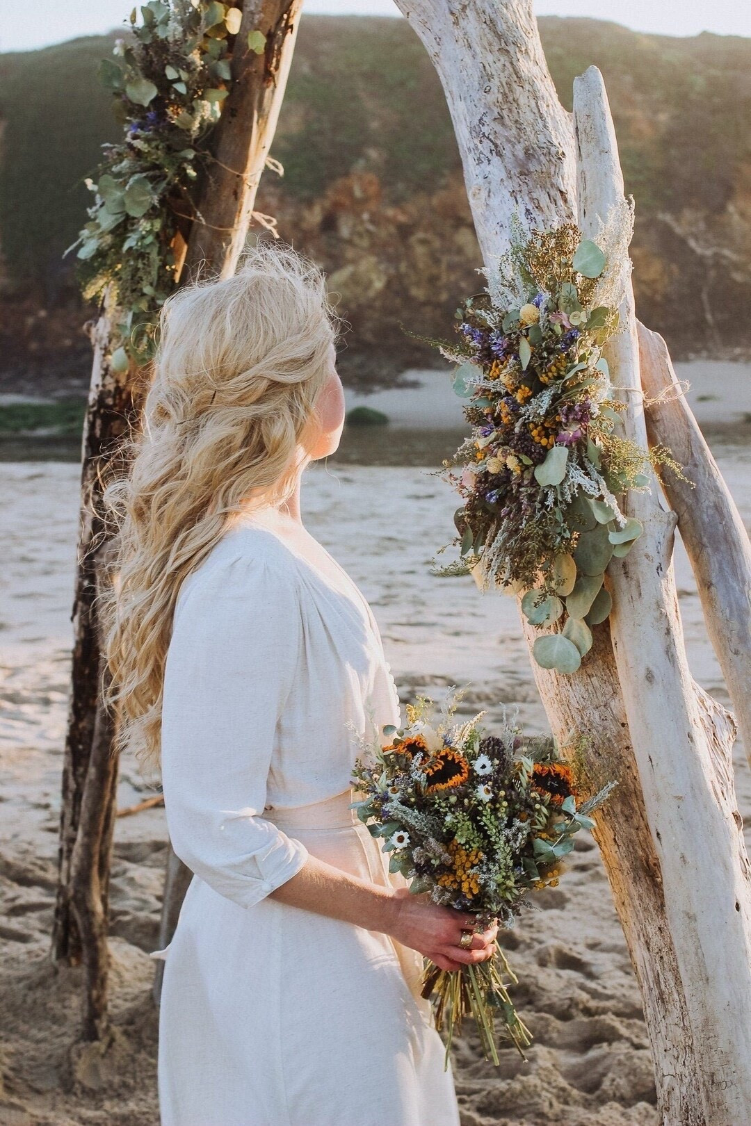 Create a stunning ceremony backdrop with this handcrafted wedding arch piece by NustadFamilyRanch. Designed with real eucalyptus, tansy, and oregano, this arrangement brings soft texture and natural yellow tones to your greenery-inspired wedding. Perfect for arbors, ceremony backdrops, or even home decor after your big day, this beautiful floral piece adds timeless charm and effortless elegance to any setting.

#LTKWedding #WeddingDecor #FloralArch #RusticWedding #BohoWedding #EucalyptusDecor #CeremonyDecor #WeddingInspiration #DriedFlowers #EverlastingFlowers #LTKHome #NaturalDecor

#LTKSeasonal #LTKHome #LTKWedding
