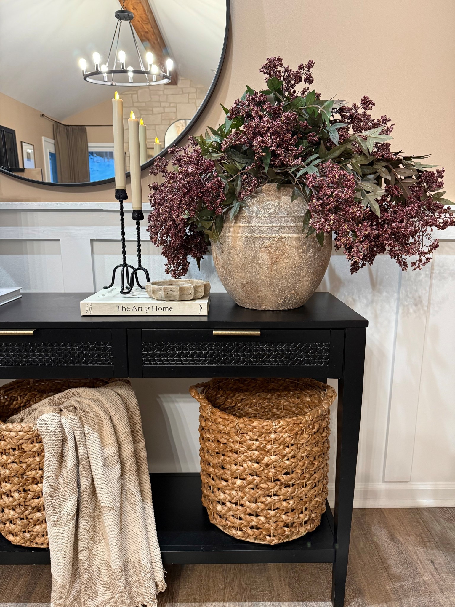 Cozy Winter Console Table Styling With Warm Neutrals

Follow @farmtotablecreations on Instagram for daily home finds, styling ideas, and cozy seasonal inspiration.

This winter console table is all about texture, warmth, and effortless layering. The oversized stone-style vase filled with 5  berry stems brings rich winter color without feeling heavy, while the black iron candleholders add height and a soft glow. A simple book stack keeps the look grounded and intentional, and woven baskets below add warmth, storage, and contrast against the dark console. Finished with a neutral throw for softness, this setup makes an entryway or hallway feel cozy, welcoming, and pulled together all season long.

#console #consoletable #entrywaydecor #entrywayinspo #winterdecor #winterhome #neutraldecor #warmneutrals #modernorganic #candleholders #berrybranches #winterstems #vasedecor #booksdecor #wovenbaskets #basketdecor #throwblanket #layeredhome #homeinspo #homefinds #decorfinds 

#LTKSaleAlert #LTKFindsUnder50 #LTKHome