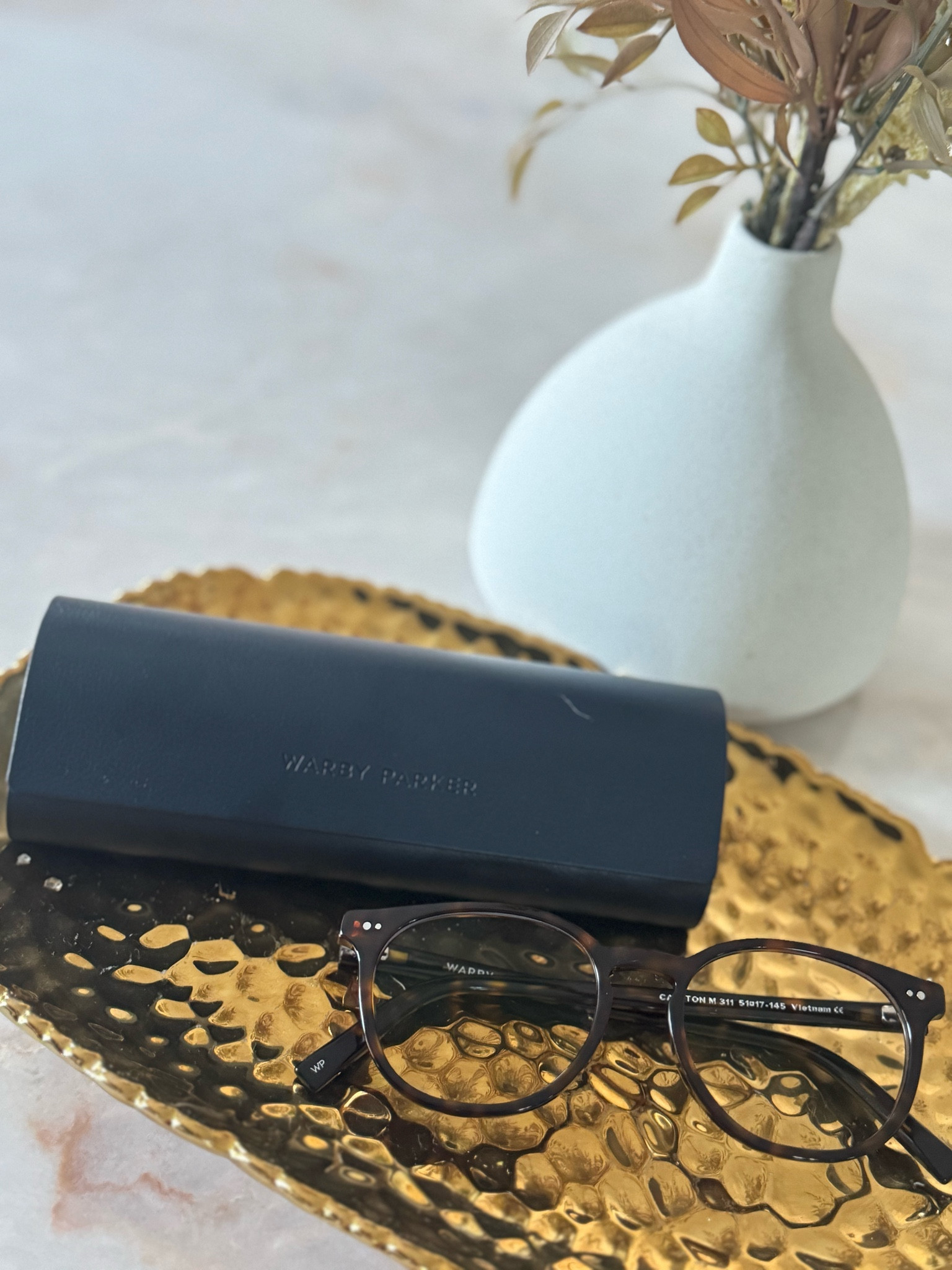 Bluelight glasses from Warby Parker. These are the Carlton in Ristretto Tortoise. 