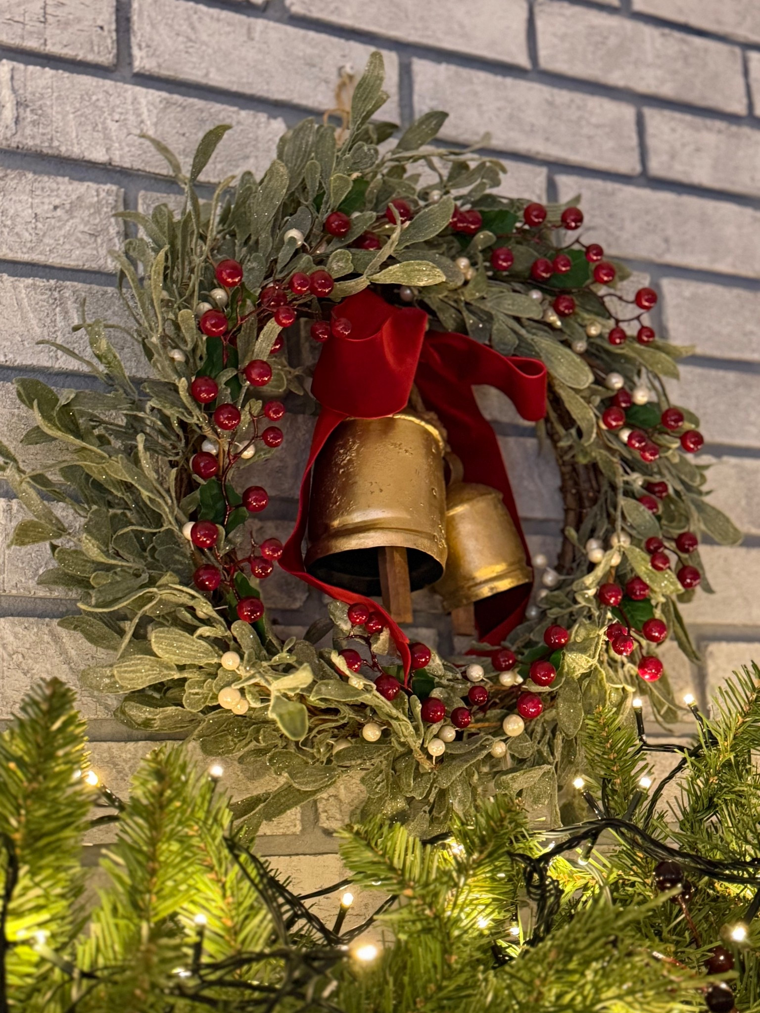 Cozy above mantel wreath styling with LED  lights illuminating it all! 

#LTKSeasonal #LTKHome #LTKHoliday