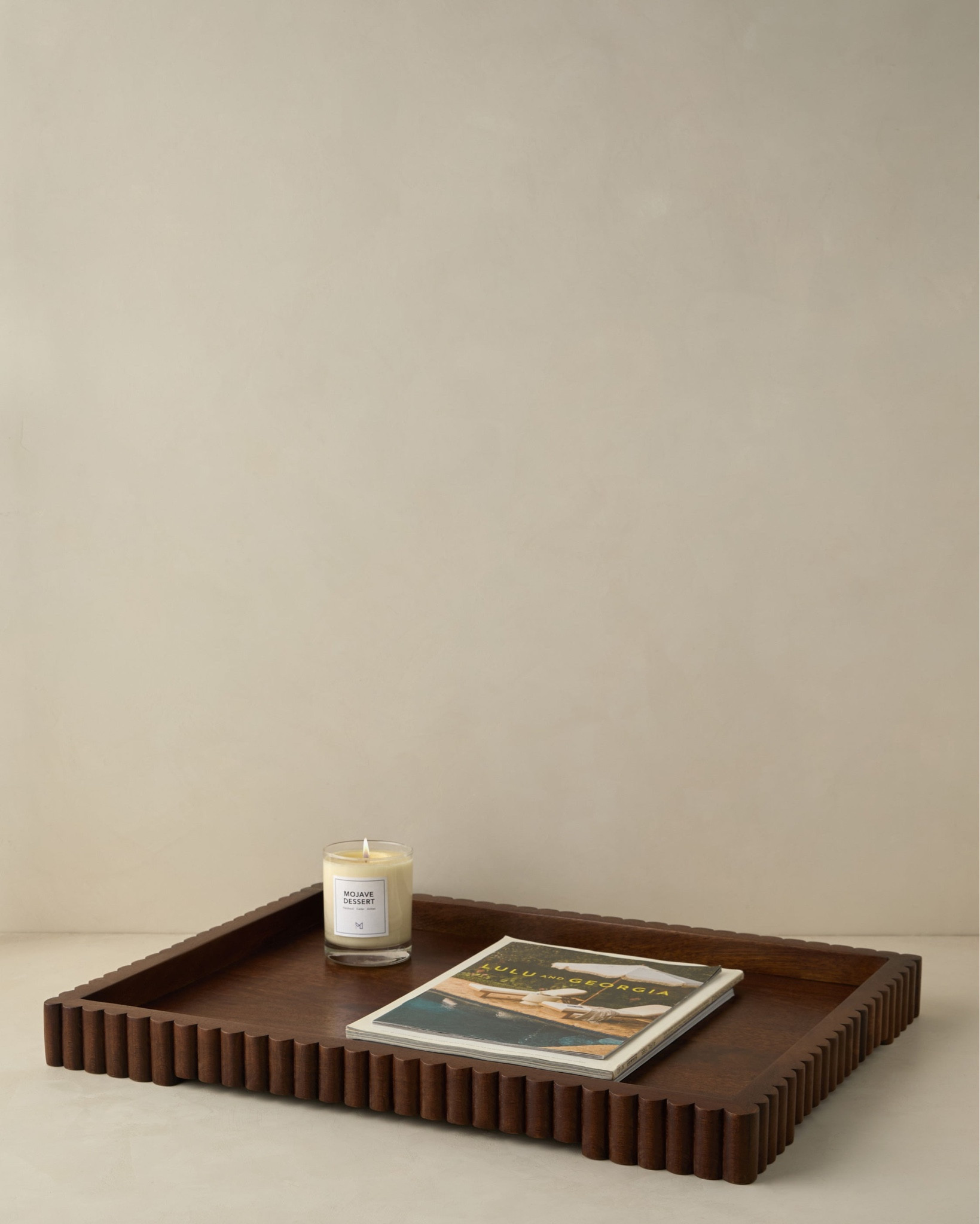 The fluted sides of this acacia wood tray bring a touch of texture and chic edge to any tabletop, helping you curate surface space that's stylish and functional. The natural grain of the wood offers a good dose of organic warmth under a rich finish.

#LTKGiftGuide #LTKSaleAlert #LTKHome