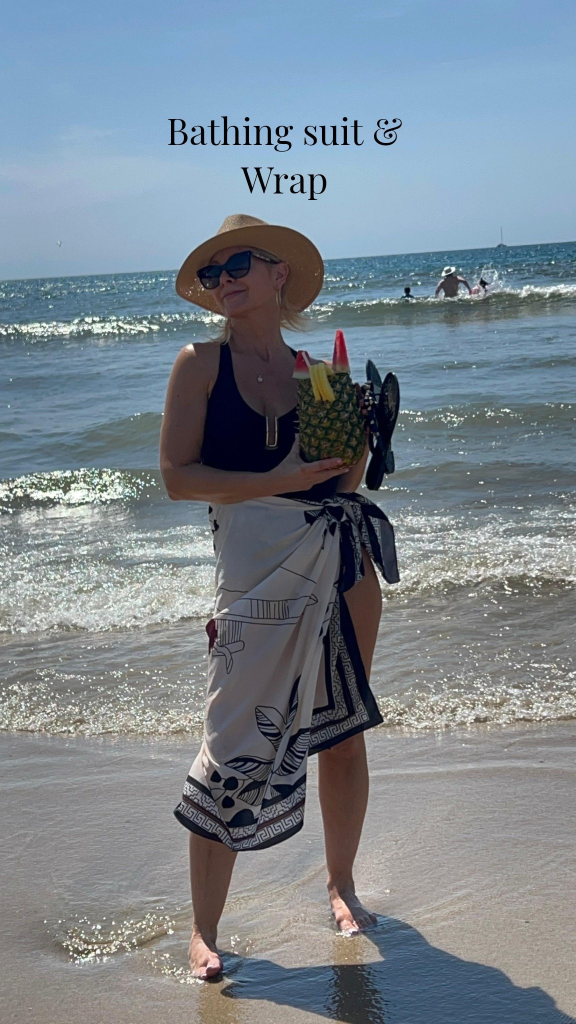 Wrap skirt & one piece black bathing suit, sun hat & sunglasses 

Wearing a size small 

#LTKOver40 #LTKootd #LTKSwim