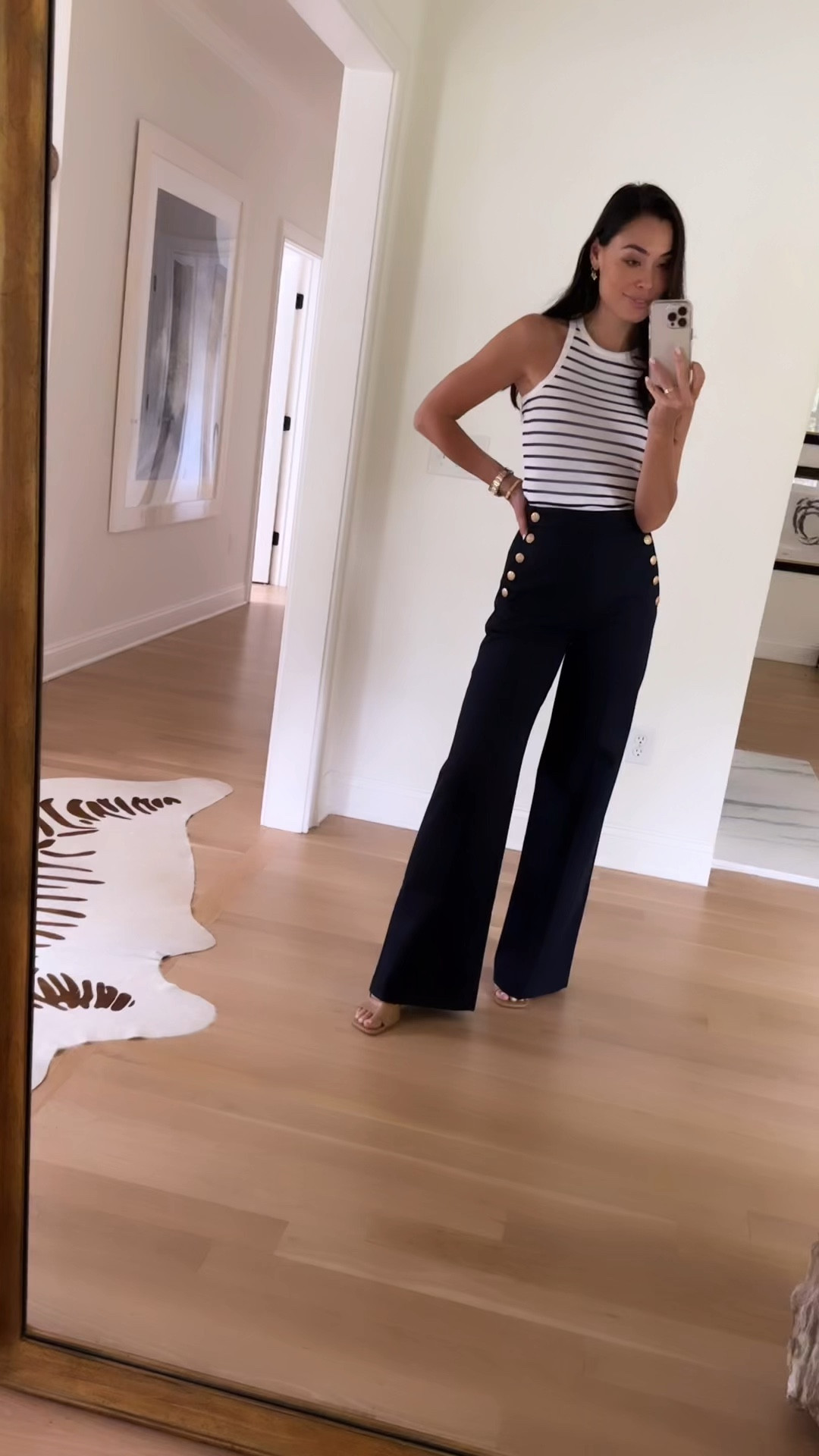 Kat Jamieson wears Sezane trousers, a stripe tank and gold watch. Workwear, office style, work, classic outfit, spring outfit, pants. 

#LTKShoeCrush #LTKWorkwear #LTKSeasonal