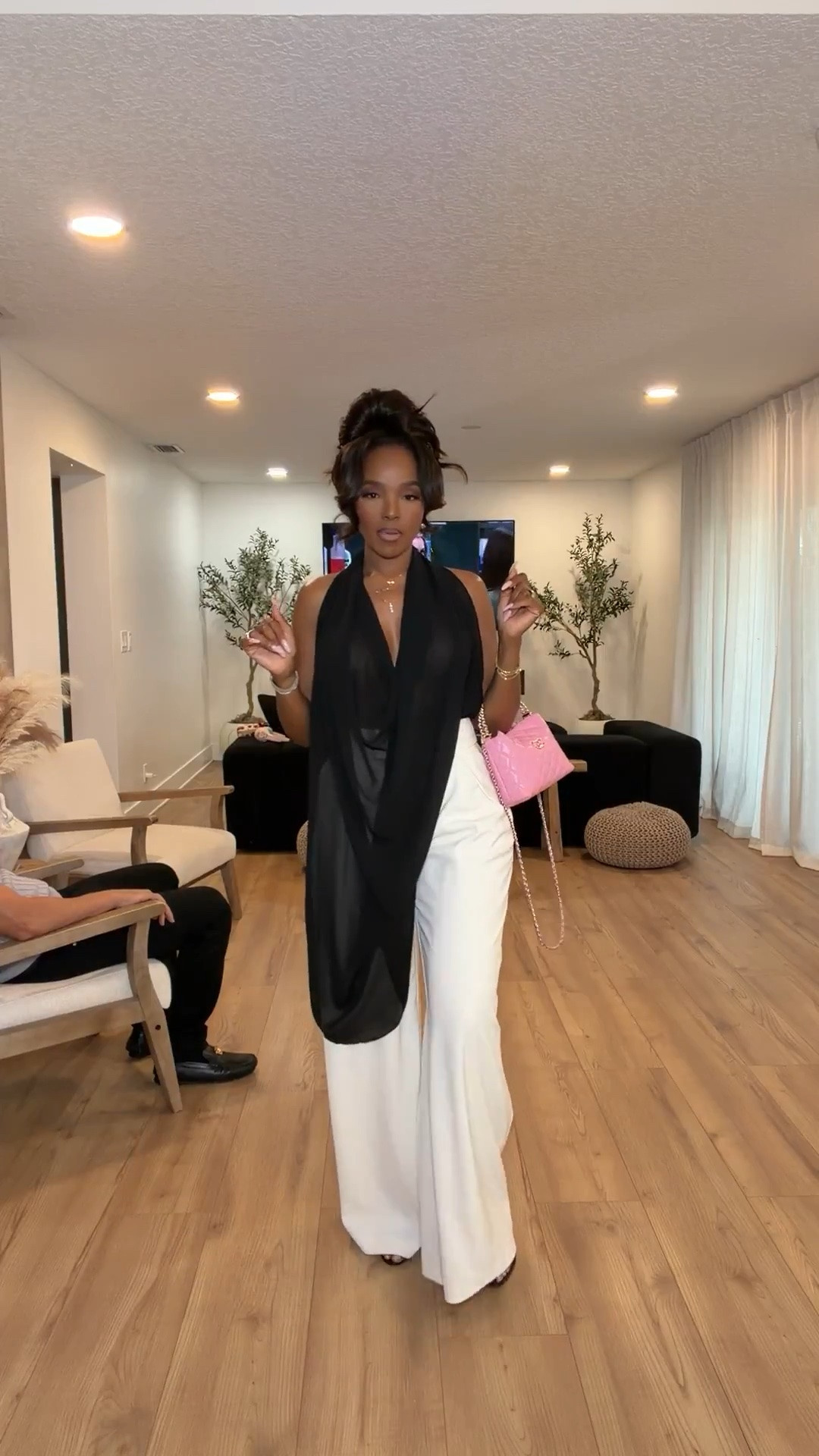 Scroll to shop this elevated black and white moment 🖤✨

This draped halter top paired with flowy white trousers is such a statement look without even trying too hard. The contrast styling feels rich, sophisticated, and effortlessly luxe, especially with the pop of pink from the mini bag. Definitely one of those outfits that instantly gives expensive energy and photographs beautifully.

Perfect for upscale dinners, vacation nights, rooftop cocktails, birthday celebrations, girls night out, and summer events.

5’4 | 140LBS | 34D-27-40 | size small or 4

Black and white outfit, elegant summer style, elevated evening outfit, chic vacation look, flowy wide leg trousers, classy dinner outfit, luxury inspired fashion, monochrome outfit aesthetic, sophisticated resort wear, dressy summer outfit, statement halter top, quiet luxury style

Follow me on Instagram and YouTube @kirasfashionfinds

#LTKgrwm #LTKootd #LTKvlog