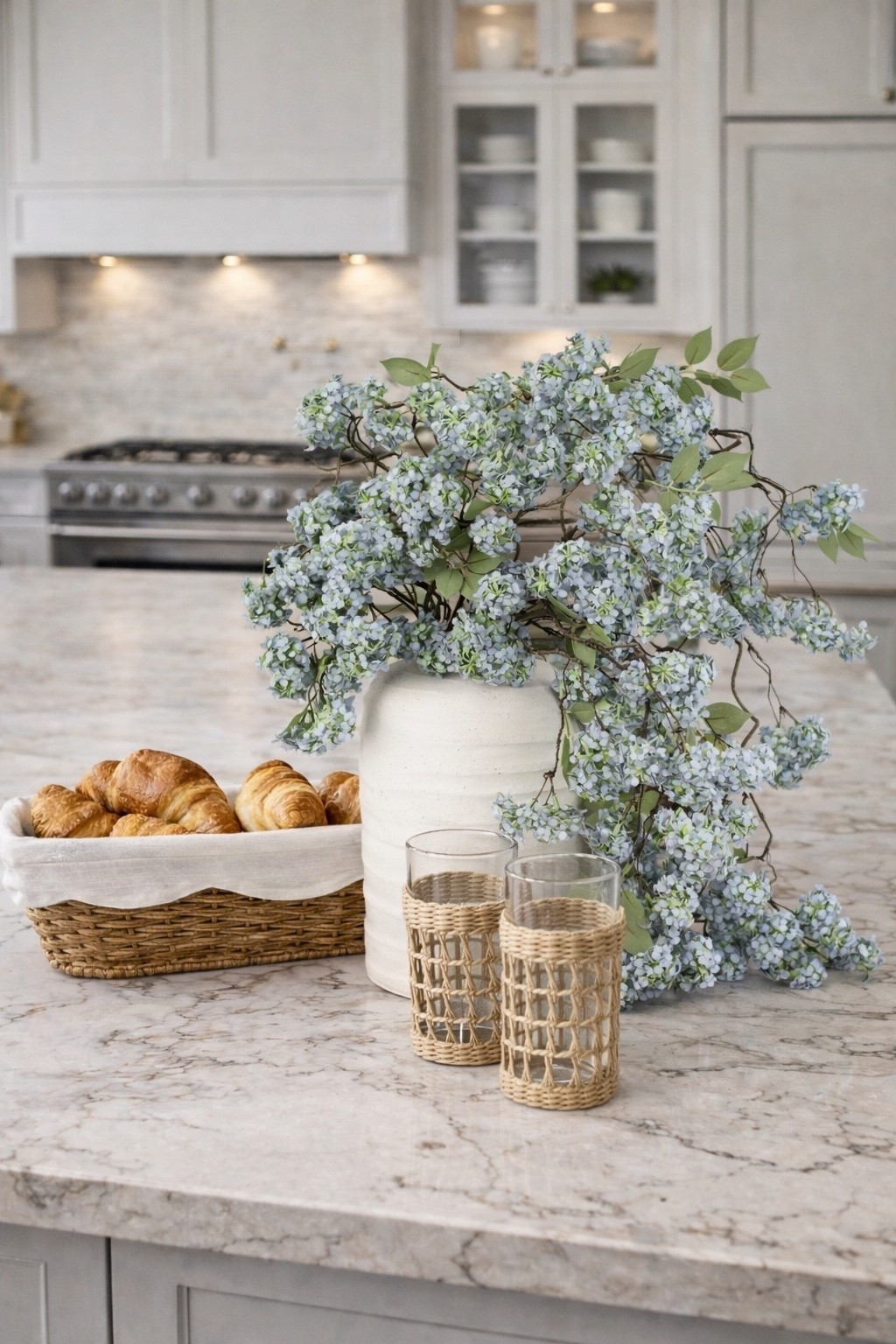 Spring Counter Styling

Follow @farmtotablecreations on Instagram for more designer-inspired home finds 🤍

Six cascading floral stems styled in a matte ceramic vase create a full, high-end arrangement that instantly elevates a kitchen island or countertop. The soft blue tones with fresh green centers bring a light spring feel while the natural drape of the branches adds movement and organic texture. This look feels polished yet effortless — perfect for everyday styling, entertaining, or brightening a neutral kitchen year-round without maintenance.



#vase #floralstems #hydrangeas #kitchendecor #countertopdecor #springdecor #kitchenstyling #tabledecor #homedecor #amazonhome

#LTKHome #LTKSeasonal