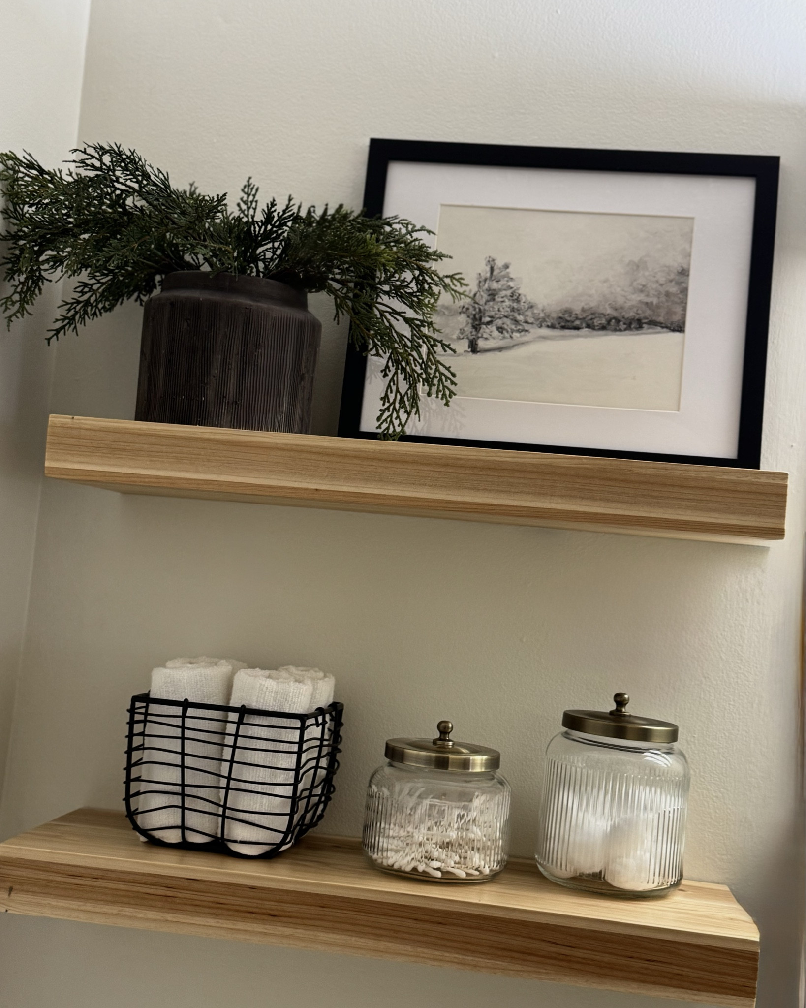 Christmas bathroom styling, faux cedar stems, framed winter art, Christmas art, bathroom storage, bathroom canisters, bathroom winter styling 

#LTKSeasonal #LTKHoliday #LTKHome