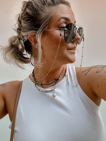 Boho beachy accessories for vacation Miami Beach look. Rainbow beaded necklace choker with sea shell. Gold choker (12mm) paired with gold chain sunnies holder and diff sunglasses

#LTKU #LTKSeasonal #LTKFestival
