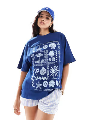 ASOS DESIGN oversized t-shirt with seashells patchwork graphic in navy | ASOS (Global)