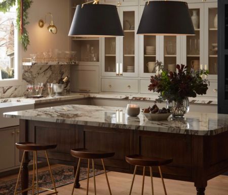 The warm brass cabinetry hardware, the sleek yet elegant pendants and the holiday greenery on the kitchen island create a feel to celebrate. 

#LTKparties #LTKhome #LTKHoliday