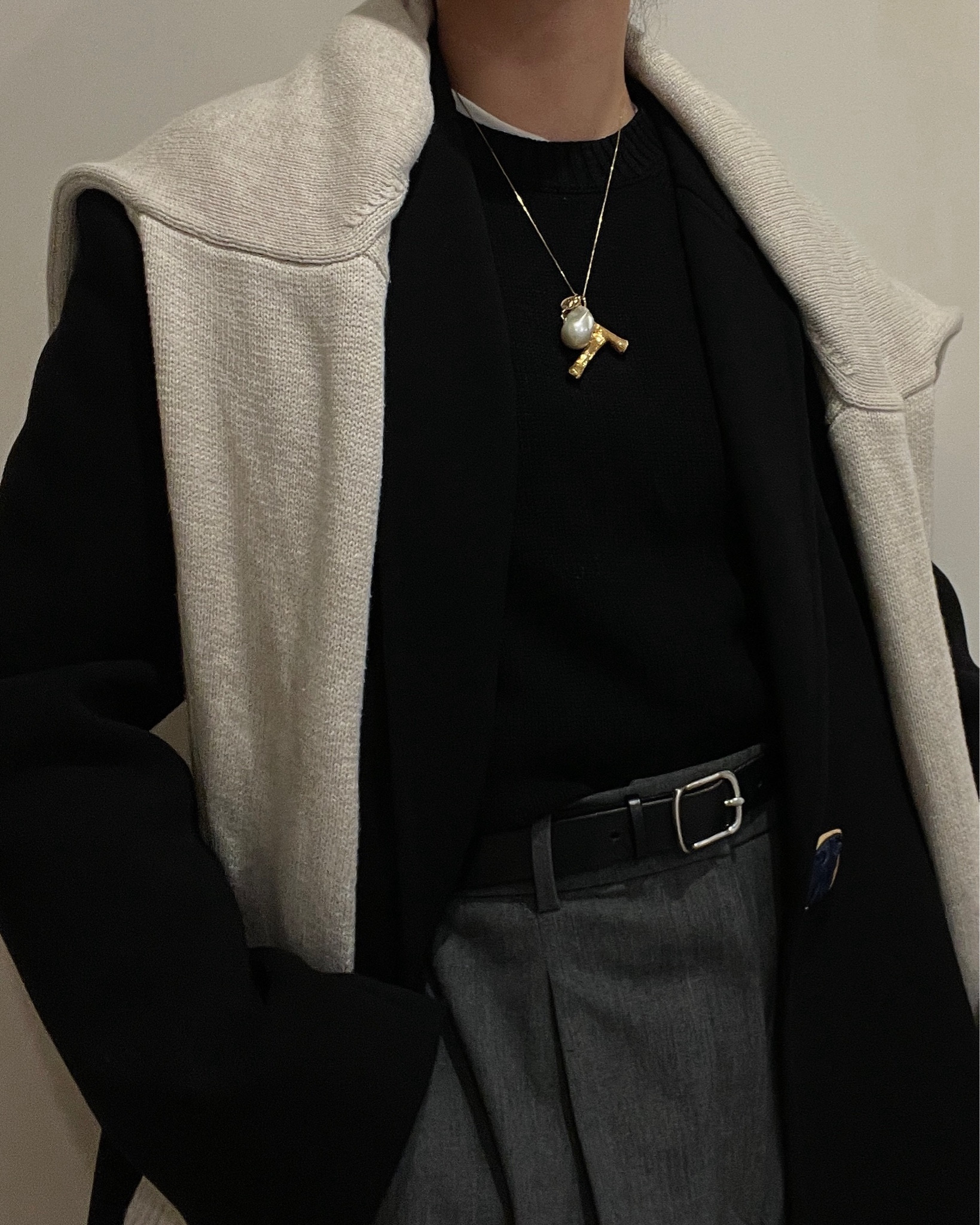 My no-fail outfit formula when it’s too cold to function in SF but I have to get dressed anyways: Neutrals in relaxed proportions that make me feel like I’m in my PJ’s. The crewneck tank acts like a base layer for warmth and the hint of it from under the sweater is a subtle detail that punctuates the layered look. Oversized sculptural coat to elevate the basics underneath while maintaining the comfort factor. Functional accents like an extra sweater as a scarf, refined belt to offset the casual sneakers, soft scrunchy bag to carry things with a sense of ease, sentimental statement jewelry to add shine and a personal touch. Hair back for a sleek contrast to the outfit’s volume. Red lip for a little burst of energy. Always a cap and gloves in my bag, just in case.

#LTKworkwear #LTKstyletip #LTKover40