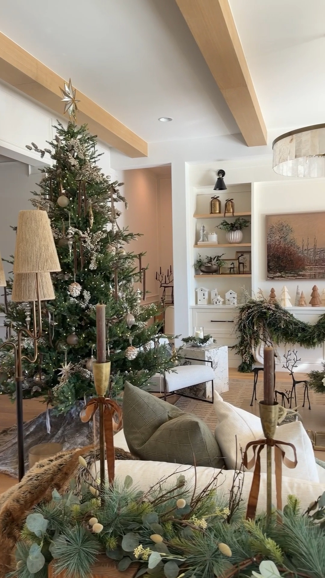 Holiday living room views

Modern organic holiday home decorated with Pottery Barn holiday décor, featuring a warm neutral color palette, rustic textures, and elevated seasonal styling. Neutral Christmas decor with soft whites, warm taupe, beige, and subtle bronze tones styled throughout a modern yet cozy home. Pottery Barn holiday decorations including lit garland, faux pine stems, wreaths, oversized ornaments, ceramic village houses, glass candle holders, brass accents, sculptural reindeer, and timeless Christmas trees styled in an organic, understated way. Rustic modern holiday decor layered with natural elements like wood, stone, linen, wool, greenery, and soft ambient lighting to create an inviting, lived-in aesthetic. Modern organic Christmas styling that blends traditional holiday warmth with clean lines, neutral textures, and thoughtfully curated décor moments. Holiday home inspiration featuring a neutral living room, dining room, entryway, and cozy gathering spaces styled with Pottery Barn garland, candles, ornaments, and statement holiday accents. Aesthetic holiday home with a refined rustic feel, showcasing simple yet elevated seasonal décor that feels timeless, calming, and welcoming. Neutral holiday decorating ideas for a modern home that prioritize texture, warmth, and organic materials while maintaining a minimal, high-end look. Pottery Barn holiday home decor inspiration for anyone looking to create a cohesive, modern organic Christmas style with neutral tones, classic silhouettes, and soft glowing details.

#LTKHoliday #LTKSeasonal #LTKHome