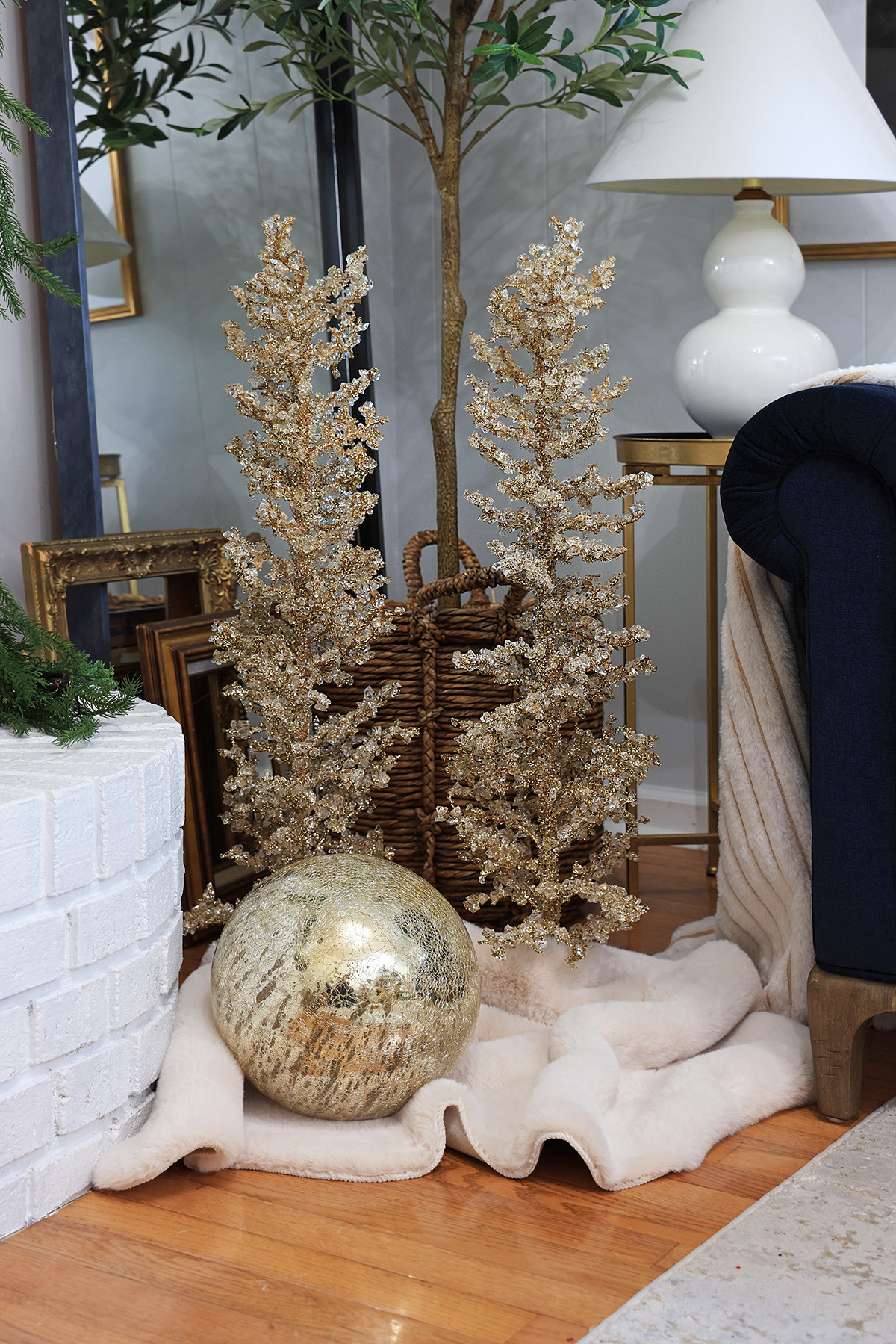 Holiday vignettes | Add jeweled glass Christmas trees and large ornaments, such as mercury glass orbs that light up, on a soft fur rug.  

 #LTKHoliday #LTKSeasonal #LTKHome