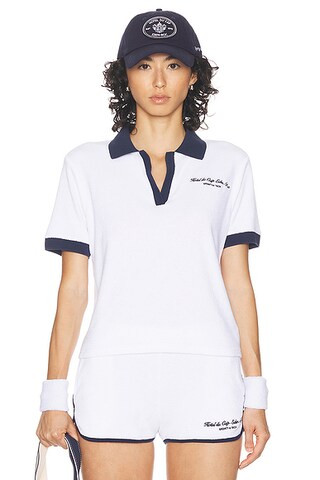 Sporty & Rich Hotel Du Cap Cursive Terry Polo Top in White & Navy | FWRD | FWRD 