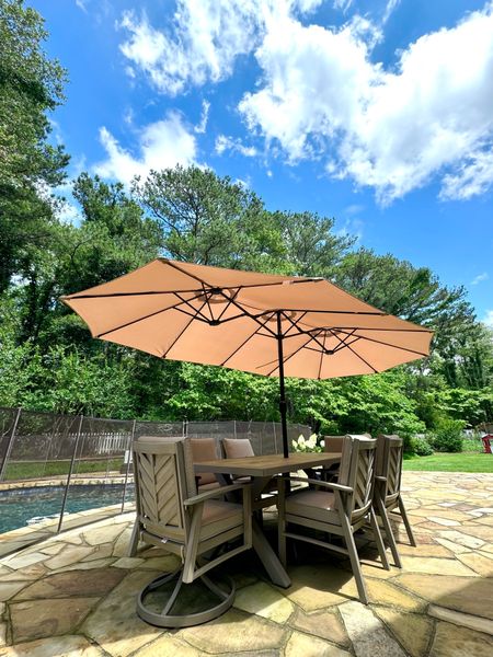 amazon umbrella , 15 feet 
Costco patio set : SunVilla Harrington 7-piece Outdoor Dining Set (currently online, just google the patio set name!) 
Affordable outdoor home finds / summer backyard pool furniture 

where has this gigantic (and affordable🙌🏻) umbrella been all of these southern summers?! no more moving chairs every 5 minutes in a PIVOT to avoid the scorching sun. we live in the backyard in the summer and instead of melting I’m feeling optimistic about July and August. 
#NoSunClub  

#LTKHome #LTKSwim #LTKFamily