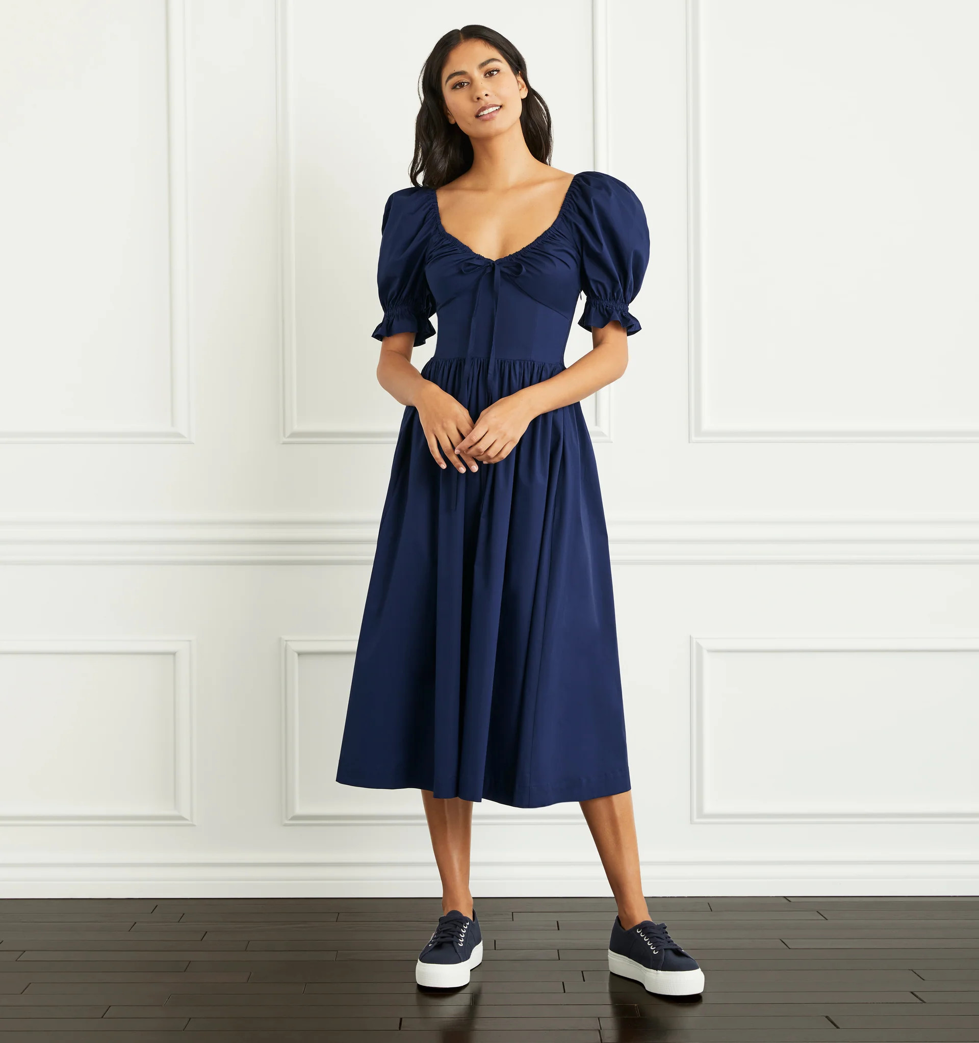 Ashika is 5'9.5" and wears an XS in the Navy Poplin | Hill House Home