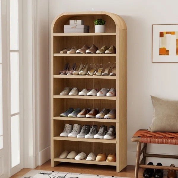 I really like this kind of storage because it keeps shoes easy to grab without making the entryway feel messy. This 21-pair shoe cabinet from Wayfair has 7 tiers, a warm light-wood finish, and the cutest rounded top that gives it more personality than a basic shoe rack. There’s even an open shelf up top for a framed photo, little vase, or everyday catchall. It’s included in Wayfair’s 30-Day Low Price right now.