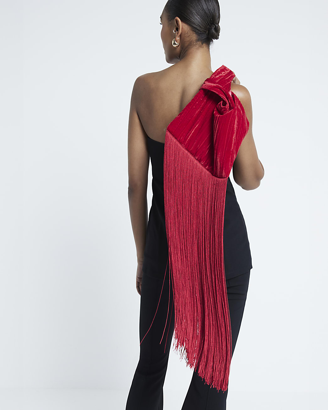 Red tassel clutch bag | River Island UK & IE