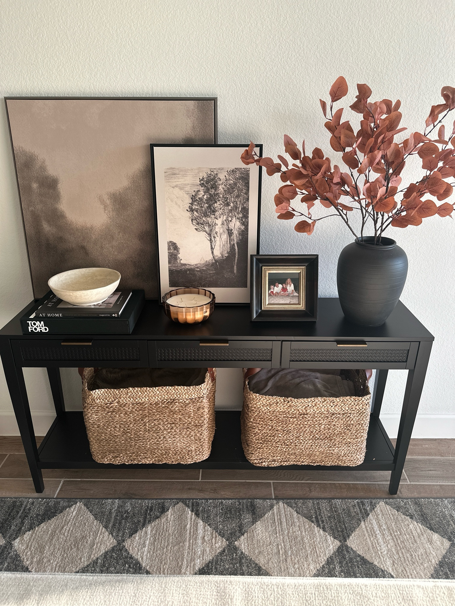 Moody Console Styling 
Console Table
Art 
Frames 
Baskets 
Large pot 
Fall stems 

#LTKStyleTip #LTKHome #LTKSeasonal