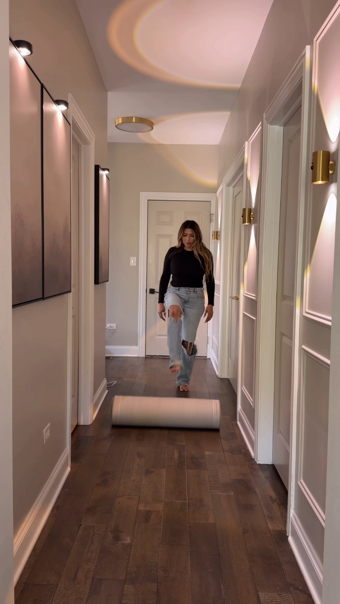 From builder basic to warm & collected 🤎✨ Proof that even the smallest spaces deserve a little intention. Added molding, oversized art, a cozy runner, and rechargeable lighting no hardwiring needed 🙌🏼 The lighting completely changed the mood and made this hallway finally feel like part of the home. ✨

#LTKHome
