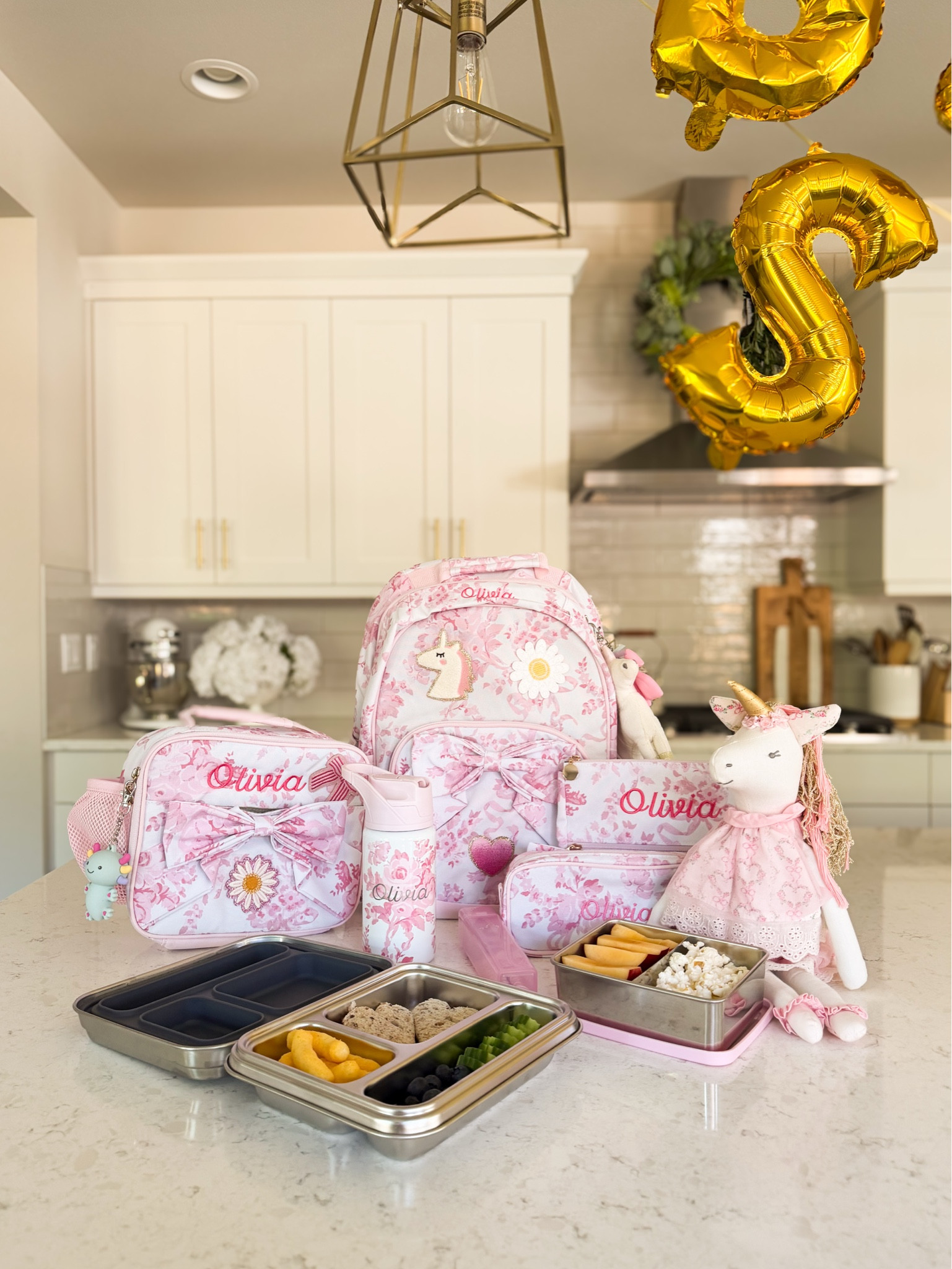 Pottery Barn Kids x LoveShackFancy collection! Back to school finds

Kids got to pick out their own backpacks, lunch bags, water bottles, patches, and charms, so everything feels uniquely theirs.
We also picked up new stainless steel lunch and snack boxes, and I had almost everything monogrammed, which means no more labeling every single item 🙌

LoveShackFancy backpack, water bottle, pencil case, pouch, lunch box, utensils, bento box, doll, backpack charms, glitter pencil case, balloons

#LTKhome #LTKsummer #LTKkids