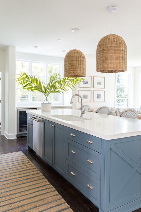 *Many of these items are currently on sale* Our Omaha kitchen decorated for summer! I can’t get enough of this blue striped jute rug and oversized faux palm leaves paired with our basket pendant lights and bistro counter stools!

. coastal kitchen design. Light kitchen decor, blue and white decor, beach vibes

#ltkhome #ltksalealert #ltkseasonal #ltkfindsunder50 #ltkfindsunder100 #ltkstyletip

#LTKHome #LTKSeasonal #LTKSaleAlert