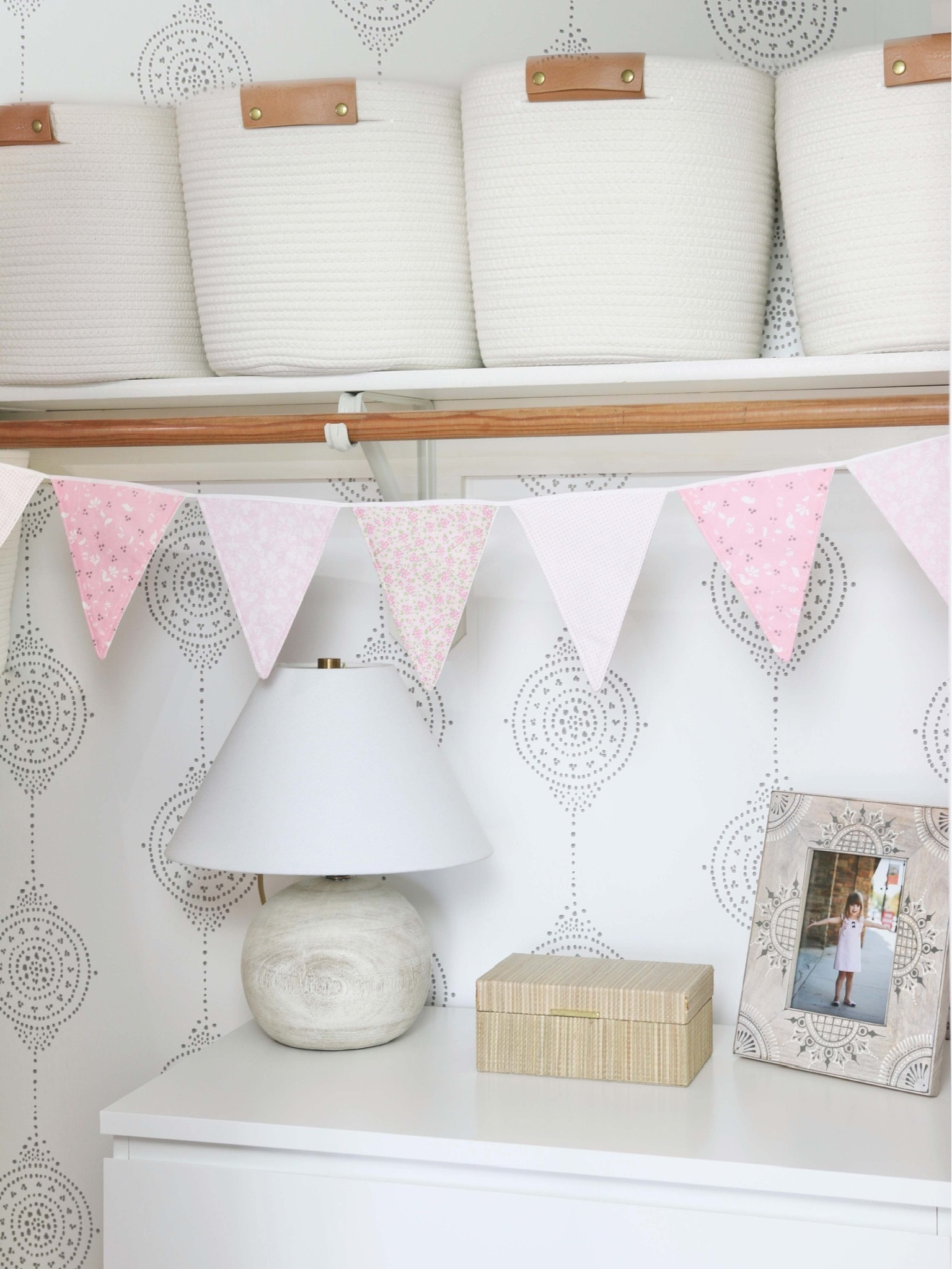 The closet in my girl’s room was an inefficient space. I put an IKEA dresser in and used coil rope baskets. I added lighting with this faux wood table lamp 

#LTKstyletip #LTKhome #LTKFind
