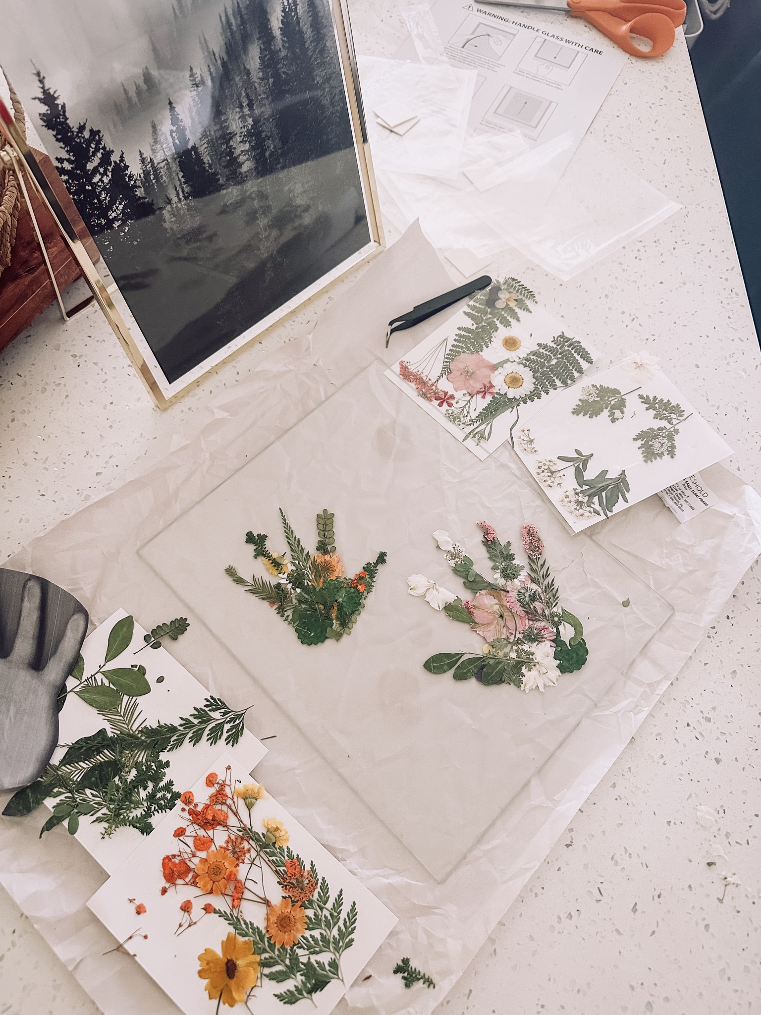 Mother’s Day Pressed Flower HandPrint Craft Idea in a floating frame. #mothersdaygift #mothersday #mothersdayhandprint #pressedflowers #handprints #floatingframes 

#LTKGiftGuide #LTKHome #LTKFamily