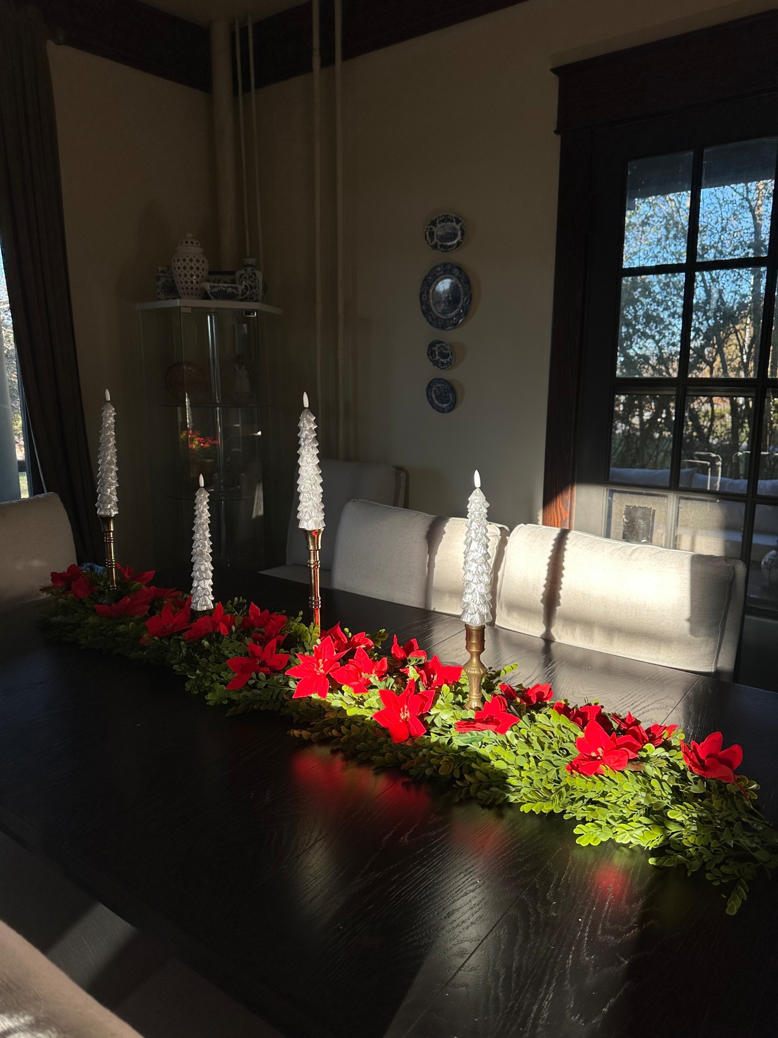 Added dollar tree poinsettias to my QVC garland! Comes as a set of 2 (5’ long), and flameless taper candles are on sale, 4 for $28
Holiday dining room
Christmas table decor 
Easy Christmas decor 

#LTKHoliday