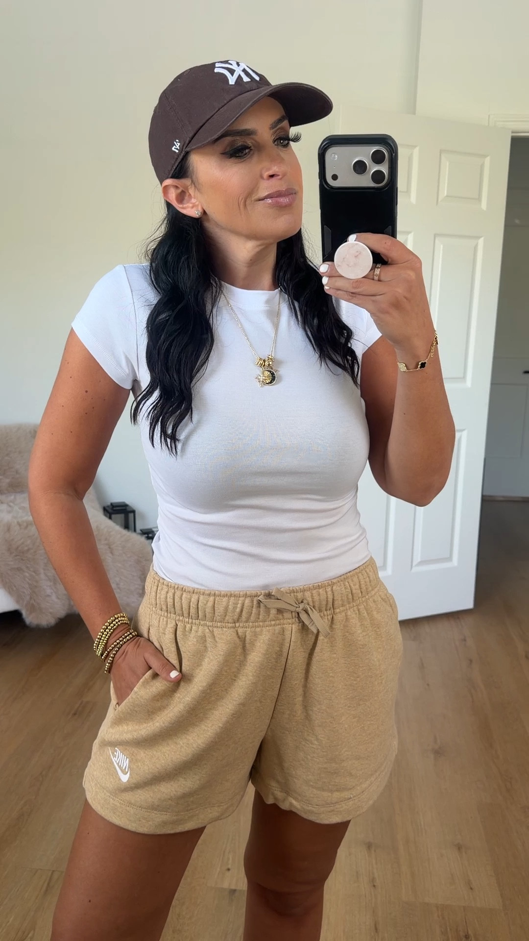 Nike sportswear club fleece women’s mid rise shorts linen heather white wearing size medium 