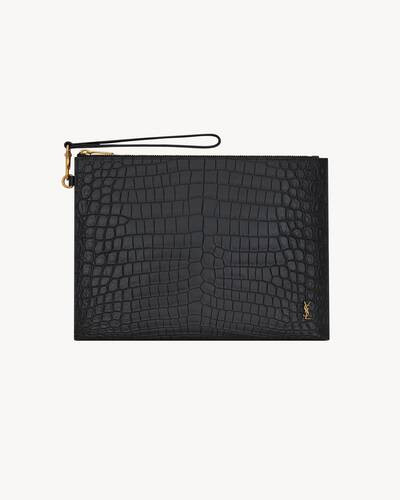 zipped tablet holder decorated with tiny metal CASSANDRE and a removable wrist strap. | Saint Laurent Inc. (Global)