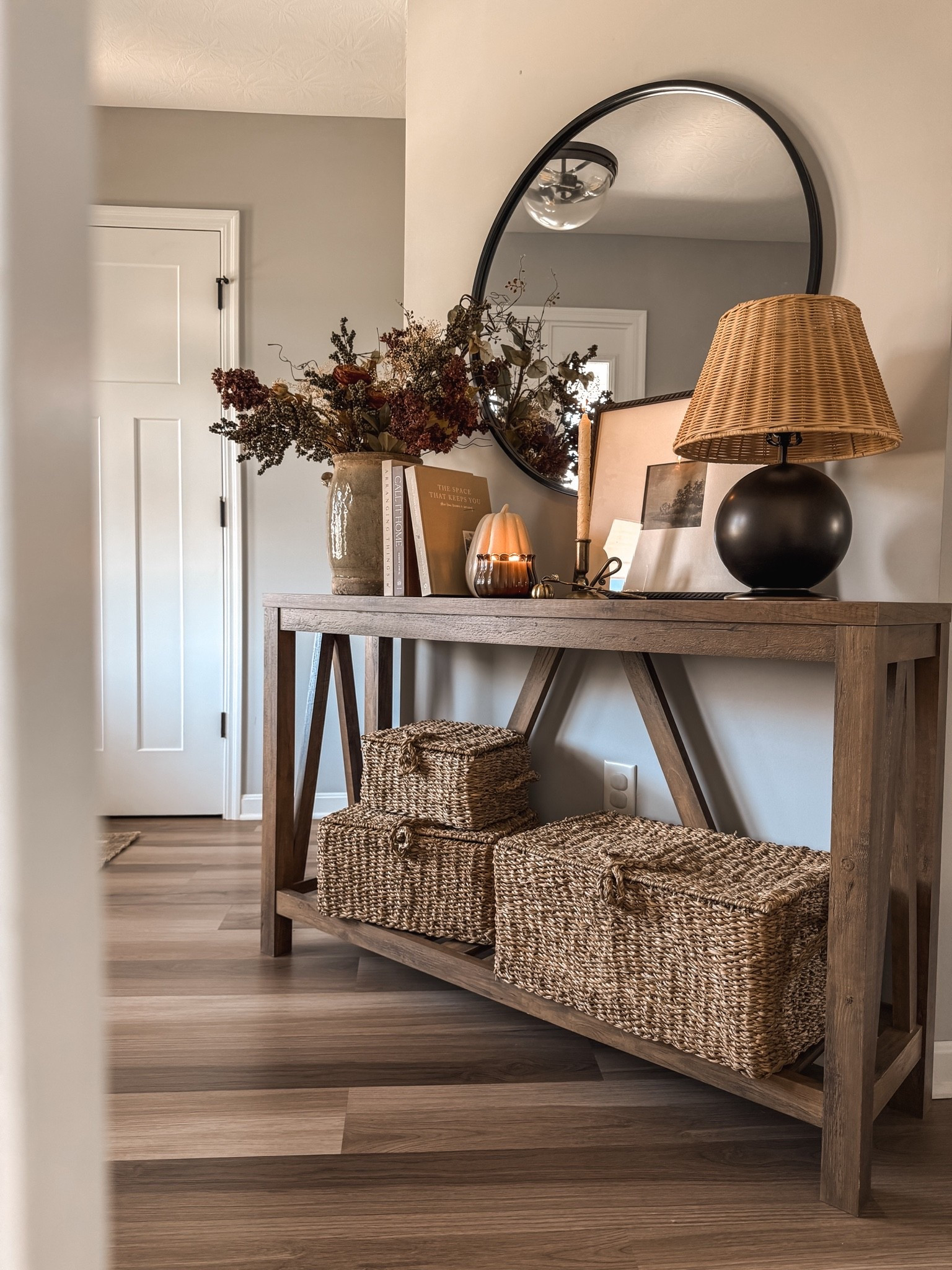 One of my favorite fall spaces — our entryway 🍂

Cozy entryway decor, entryway table styling, rustic wood console table, round black wall mirror, wicker shade table lamp, woven storage baskets, neutral entryway ideas, fall entryway decor, vintage inspired home decor, warm neutral home styling, cottage style entryway, farmhouse console table decor, entryway organization ideas, cozy home essentials, natural texture home decor, seasonal floral stems, small entryway styling, welcoming foyer decor, timeless home decor