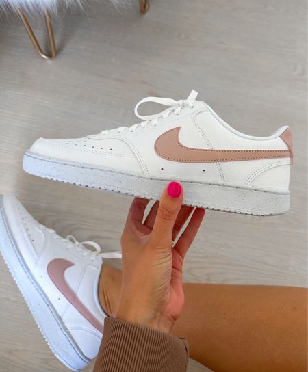 Love this pair of white and blush Nikes!

#LTKfindsunder100 #LTKshoecrush #LTKstyletip