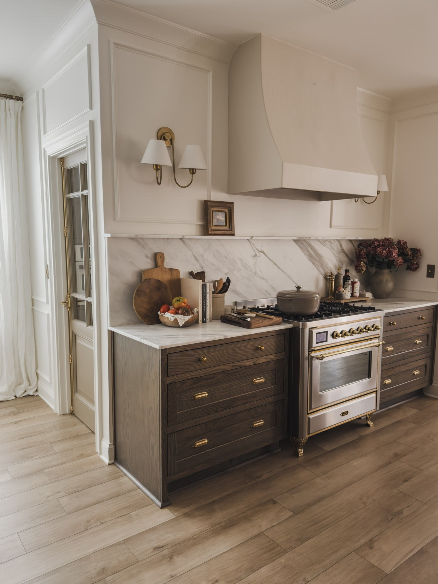 Sharing a lesser seen view of counters filled with all of my essentials in the kitchen! Utilizing a high quality butcher block that is also aesthetic, along with some of my favorite cook books and other essentials in this space.

Home finds, neutral home inspo, kitchen views, collected style, fall refresh, countertop style, kitchen essentials, rich wood tones, wooden butcher block, bread board, brass detail, double wall sconce, brass hardware, range details, prep kitchen views, faux fall florals, dutch oven, Wayfair, McGee and Co, ILVE, Rejuvenation, found it on Amazon, Caraway, Lodge, shop the look!

#LTKSeasonal #LTKHome