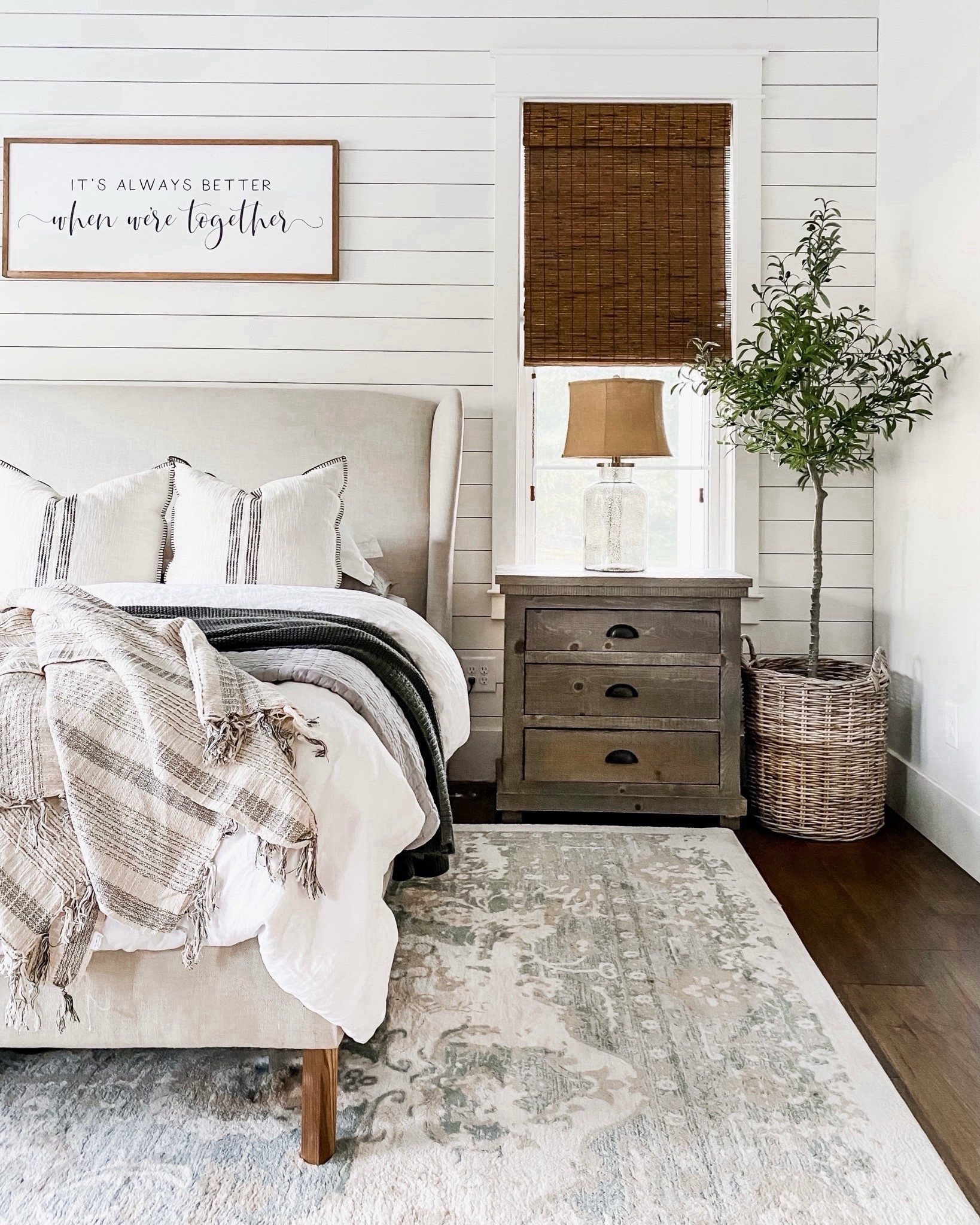 Modern farmhouse primary master bedroom upholstered wingback bed linen sheets bedding blankets and shams wall decor olive tree basket planter nightstand dresser rug mercury glass lamp target pottery barn Amazon 

#LTKfindsunder100 #LTKstyletip #LTKhome