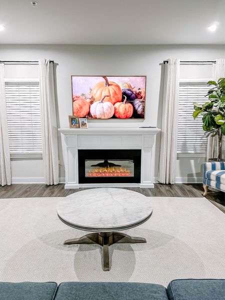 Sharing my family room. We decided to swap out our blue curtains for these neutral linen ones from Amazon. 

Amazon finds
Amazon home
Marble coffee table
Electric fireplace 
Woven rug
Jute rug 
Samsung tv styling 

#LTKhome #LTKCyberWeek #LTKsalealert