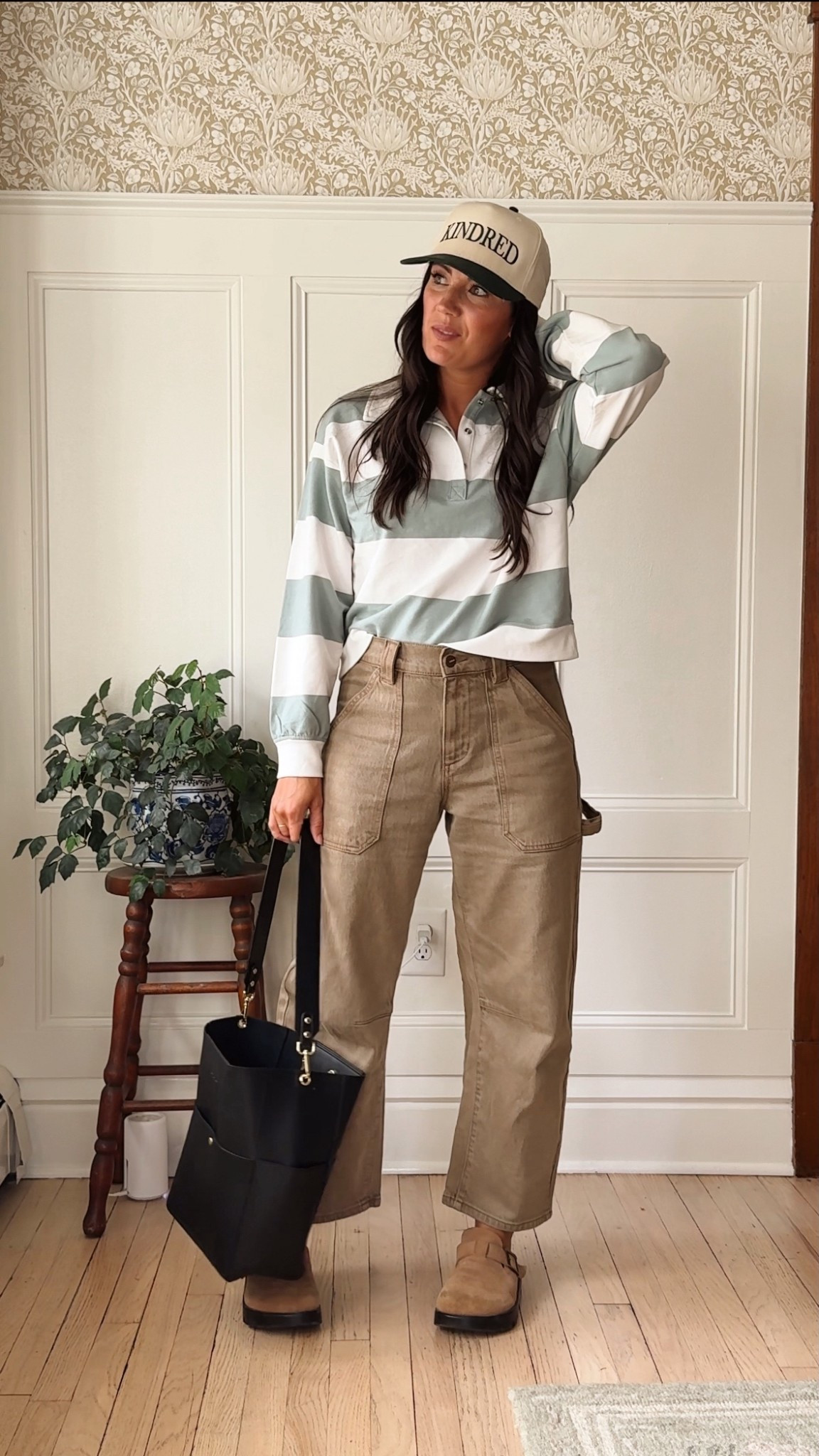 Casual, comfy, and just a little sporty — today’s uniform ✔️ A striped rugby pullover tucked into easy wide-leg utility pants, paired with suede clogs that go with everything. I topped it off with my Kindred cap (because a hat day always wins 🙌) and a structured black tote to pull it all together.

#LTKStyleTip #LTKSeasonal