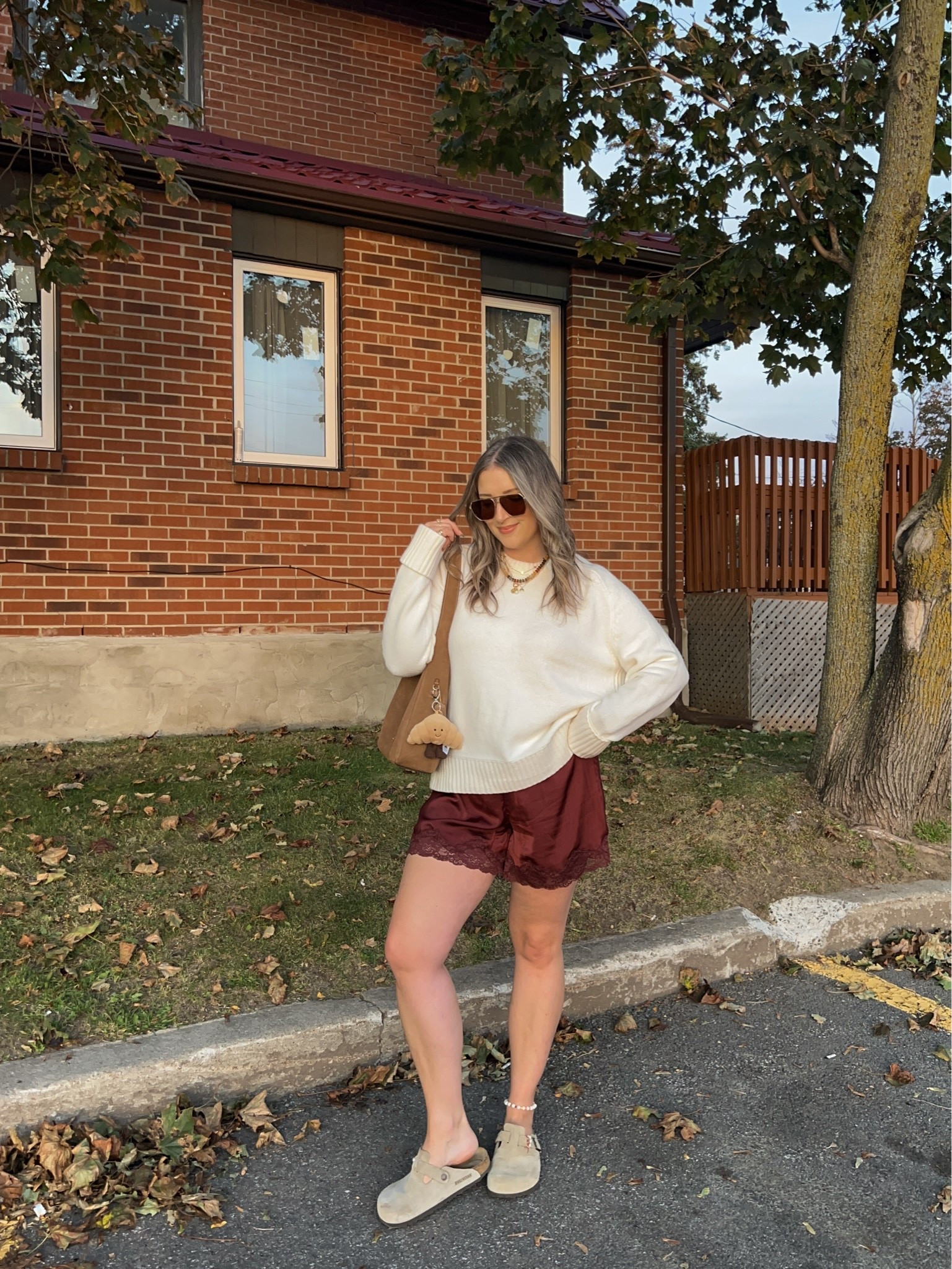 Comfy early fall outfit! Sized up to XL in the sweater for an oversized fit. Wearing M in the satin lace shorts. I’m a 9.5-10 shoe and wear a 40 in the Birkenstock clogs

#LTKfall #LTKstyletip #LTKsale