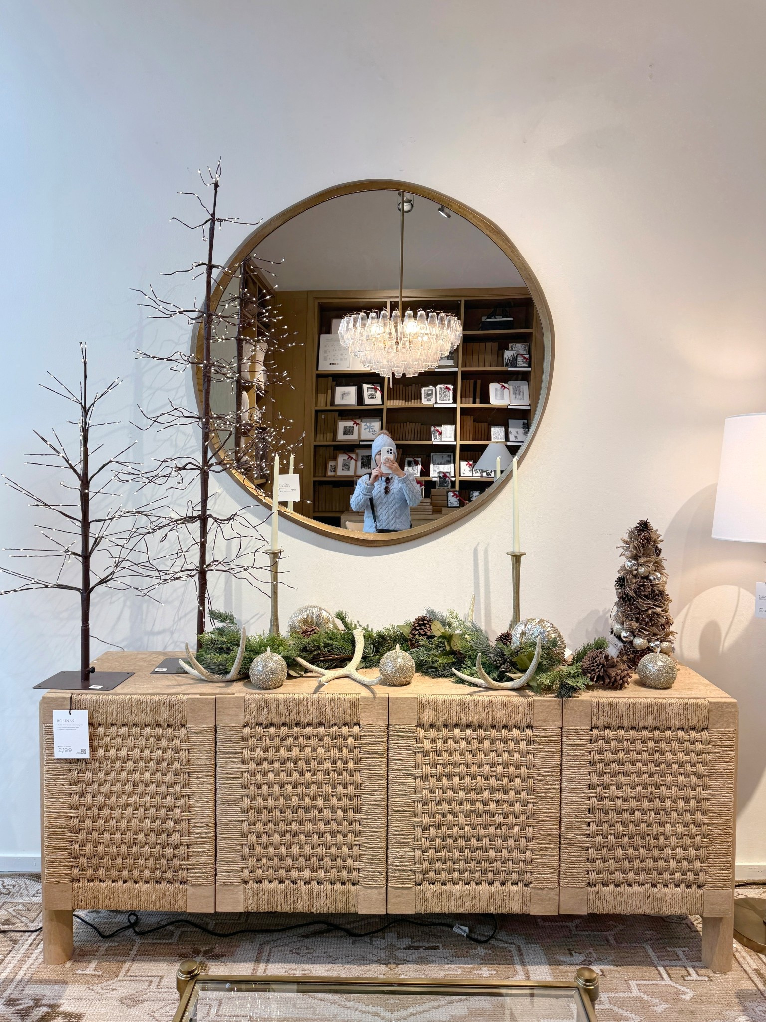 Winter styling done right! 💫The Bolinas Woven Buffet (75”) creates an effortlessly chic foundation with its woven texture and light, relaxed silhouette. ✨ Styled with soft greenery, warm metallic accents, and subtle holiday layers, it feels refined, cozy, and seasonally elevated without leaning overly festive. Finished with the Sedona Oversized Round Mirror for balance and polish—this setup is all about quiet elegance with impact! 🌟  #PotteryBarn #Sideboard #ConsoleTable

#LTKHoliday #LTKSaleAlert #LTKHome