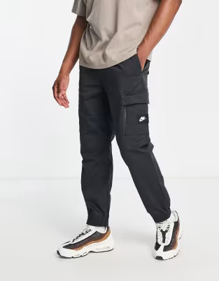 Nike Sports Utility Dri-FIT woven cargo trackies in washed black | ASOS (Global)