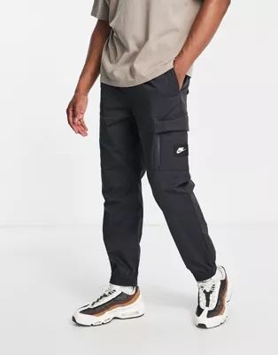 Nike Sports Utility Dri-FIT woven cargo trackies in washed black | ASOS (Global)