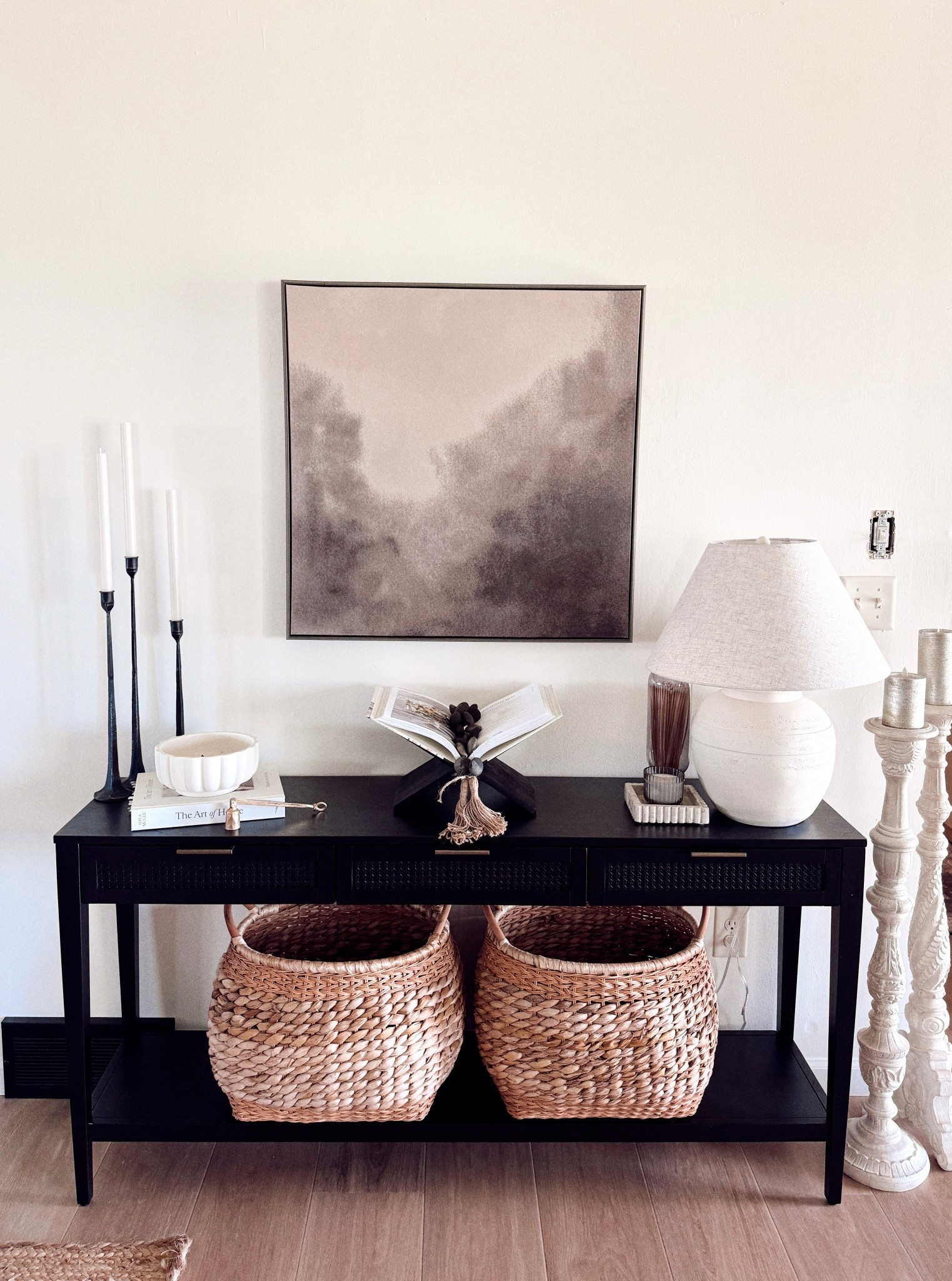 One of my favorite console table setups yet 🤍 Everything from the soft neutral artwork to the woven baskets is linked for you on my LTK! This entire look is budget-friendly and all about layering texture + tones.

— Console table
— Neutral abstract wall art
— Woven baskets
— Ribbed candlesticks
— Textured ceramic lamp
— Coffee table books & beads

#LTKhome #LTKfinds #neutraldecor #consoledecor #homestyling #budgetfriendlyhome #entrywayinspo #LTKentryway #homefinds