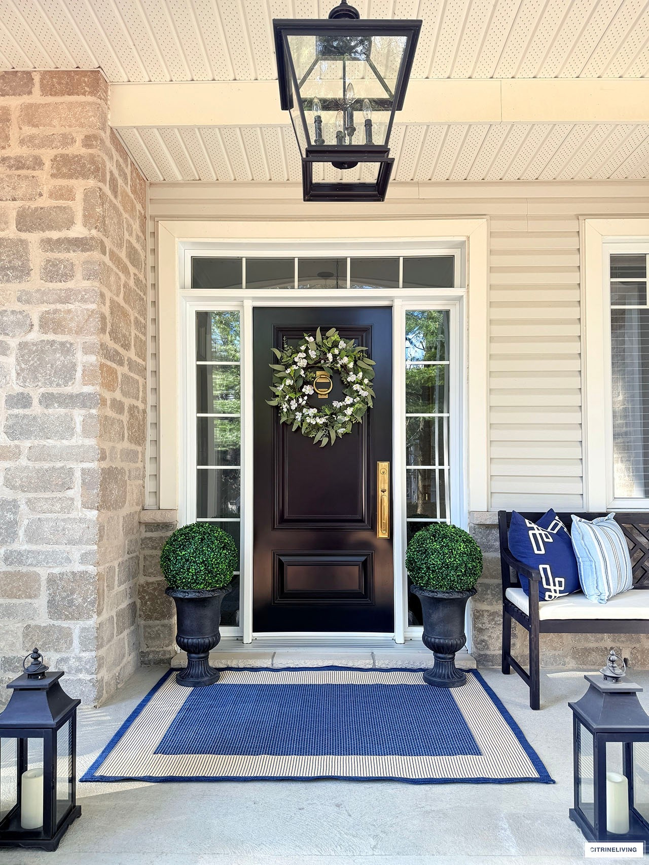 Simple, chic, elegant porch decor! Classic urns, elegant topiaries, a coastal rug, a timeless bench and lush wreath create a warm welcome!

#LTKstyletip #LTKhome
