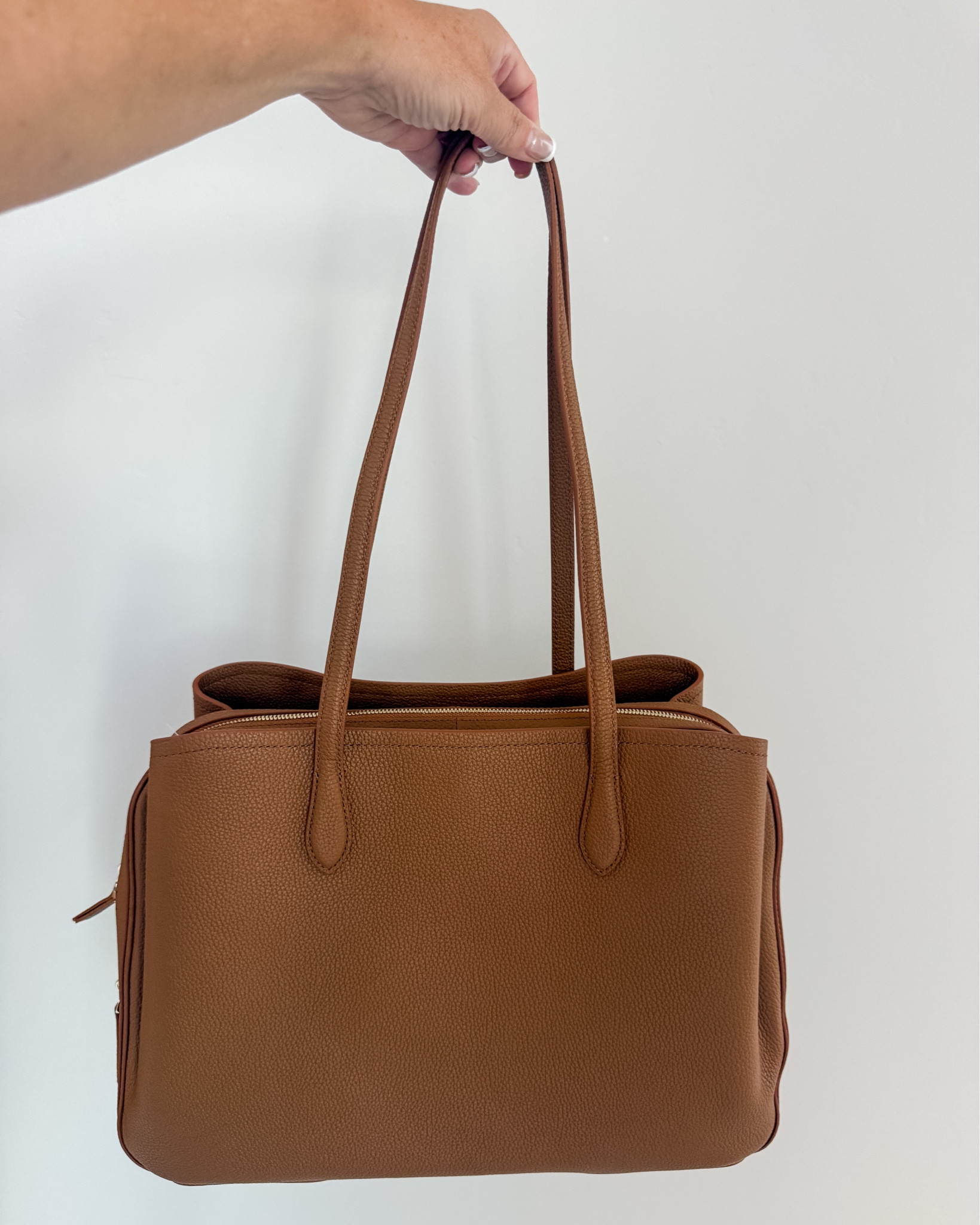 On of my favorite medium sized totes is the Vivienne Work Tote from Quince and this cognac color is beautiful paired with fall workwear!

#LTKOver40 #LTKMidsize #LTKWorkwear