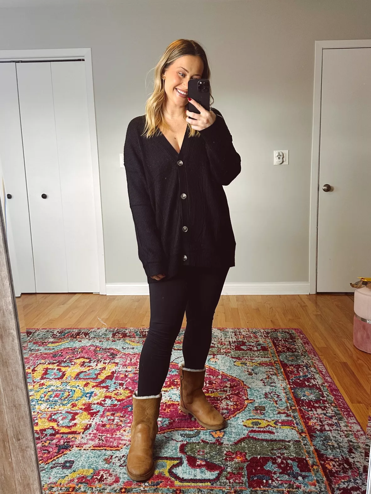 Comfortable look for winter with Ugg boots, black leggings, and