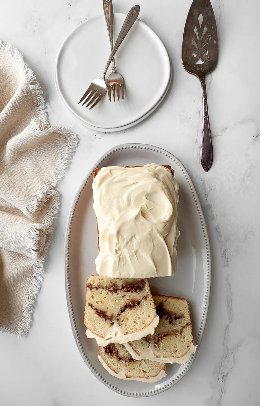 Cinnamon Roll Loaf Cake All the cozy flavor of cinnamon rolls - the swirl, the cream cheese frosting, the soft crumb - without the kneading or rising. The 8x4 loaf pan is the secret to getting the height right. Everything is linked here. Full recipe at sherisilver.com

#LTKdayinmylife #LTKfoodie #LTKSeasonal