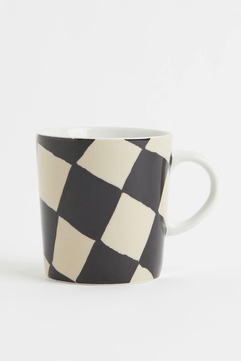 Patterned mug in porcelain with cheerful pastel colors. Diameter at top 3 1/4 in. Height 3 1/2 in... | H&M (US + CA)