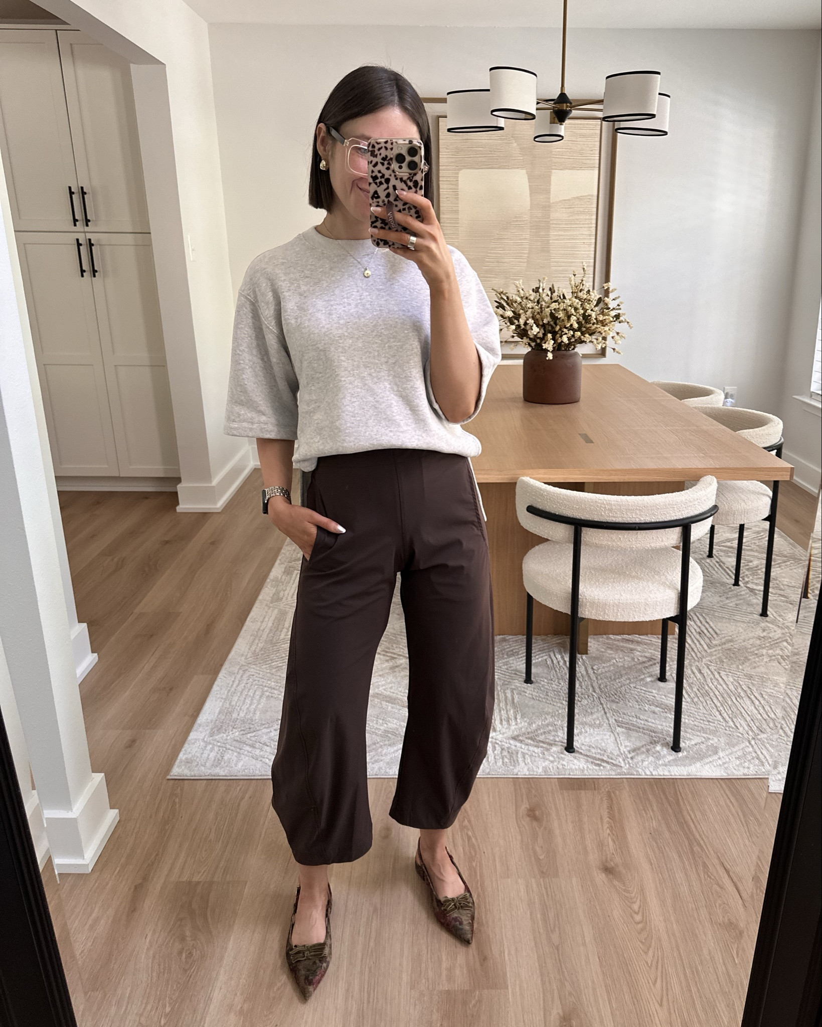 @Ruti on the loose work pants in coffee size 2 petite tts. I’m 5’3” & love the fit. These are perfect to dress up or down for traveling, running errands, or to the office.  

Circus by Sam Edelman Delanie Pointed Toe Slingback Flat with moody velvety floral design. Will keep an eye out if they come back in stock! 

Abercrombie gray short sleeve oversized fleece tee. This is so comfy and it feels like sweats but looks put together! Sold out but has come back in stock a few times! 

Gold jewelry, gold hoops, chunky hoops, ring stacks, gold band, ballet flats, sling back flats, travel outfit, airport outfit, casual outfit 

#LTKSaleAlert #LTKPetite #LTKootd