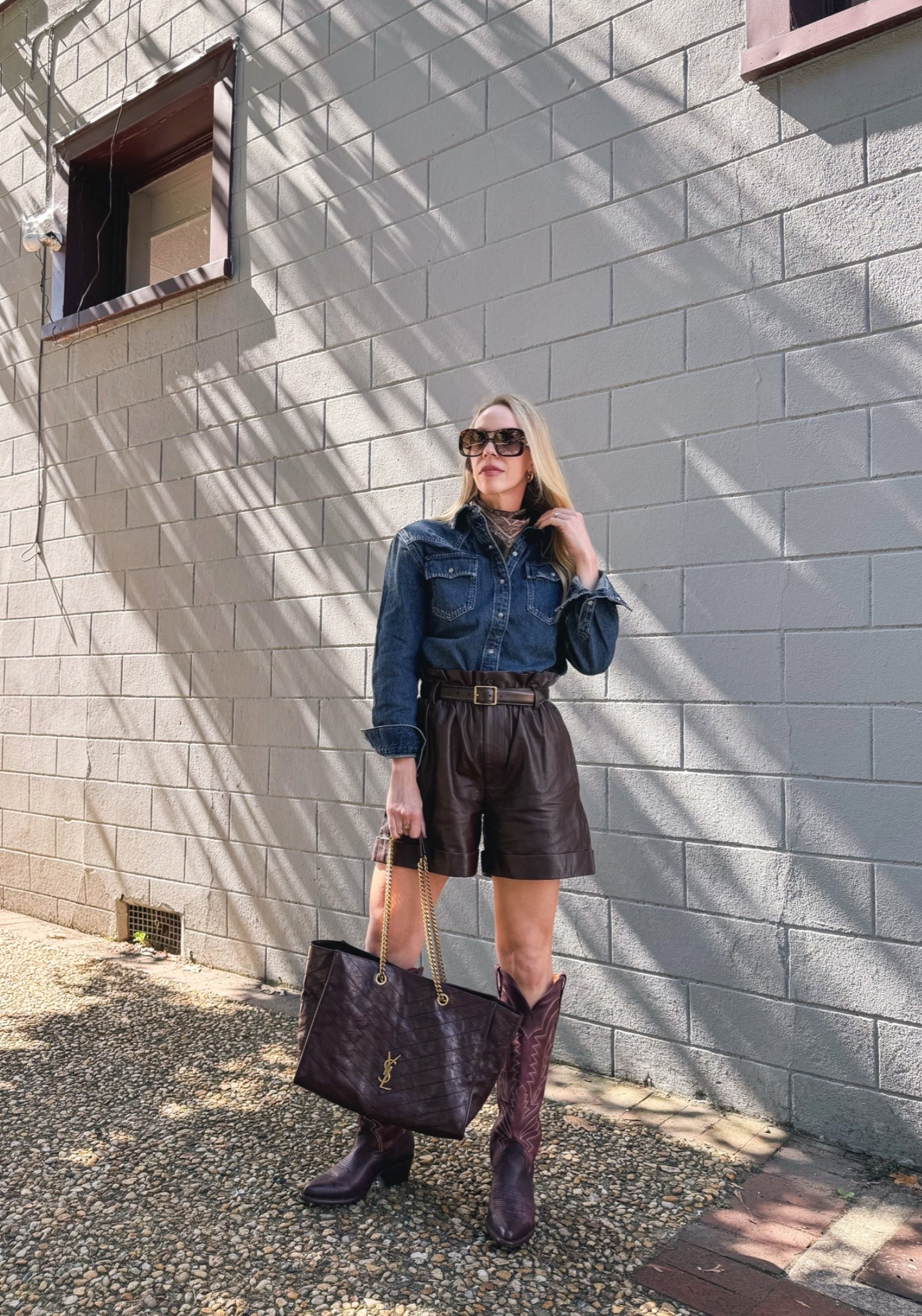 Western chic fall outfit, paisley silk scarf, leather shorts, @Tecovas burgundy cowboy boots