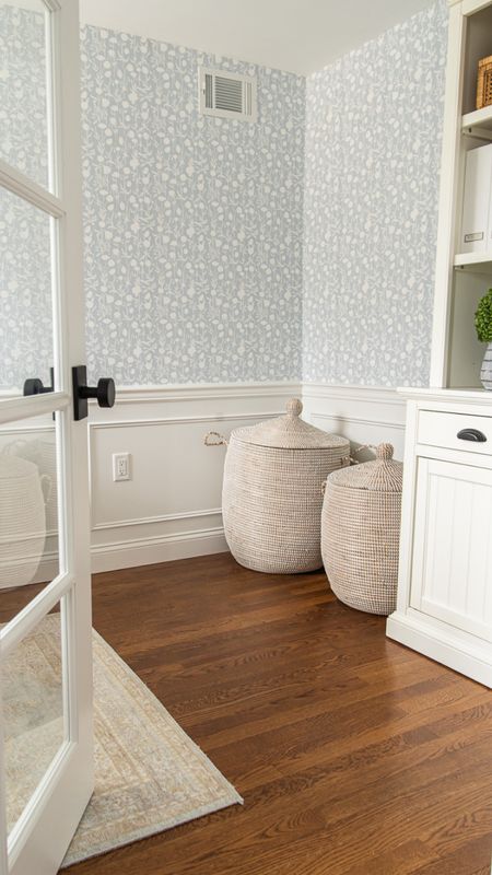 Functional home office with Serena and Lily patterned wallpaper, seagrass storage baskets, white, hutch and desk, coastal style home decor

#LTKhome #LTKfamily