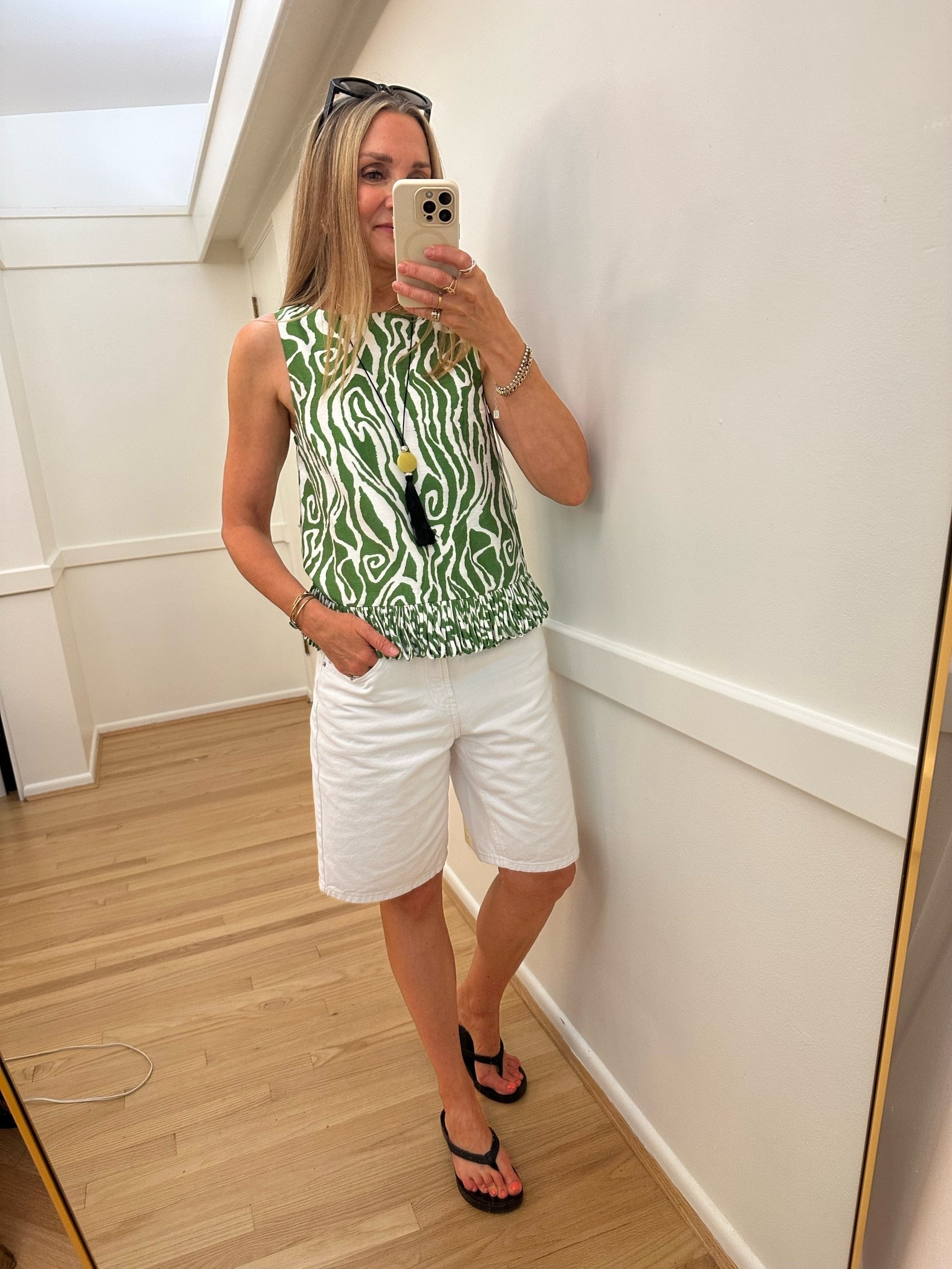 Outfit of the day for a little getaway! Cute @Avara top in a zebra stripe with fun fringe detail, wearing small. Paired with @Target white denim shorts, size 4. @Madewell tassel necklace and Olukai flip flops.

#LTKootd #LTKTravel #LTKOver40